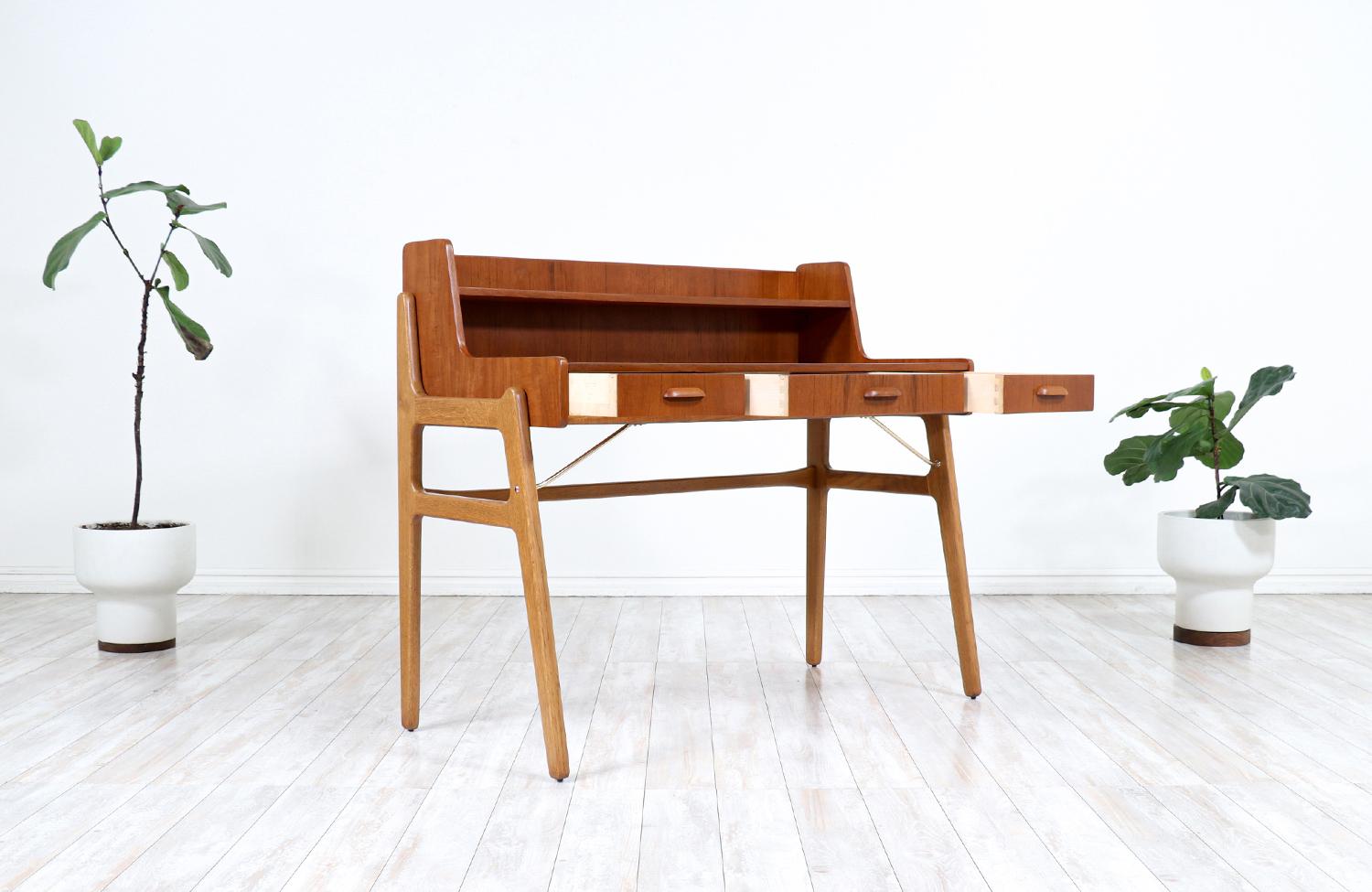 Mid-Century Modern Johannes Andersen Teak & Oak Two-Tier Desk with Brass Accents for Møbelfabrik F. For Sale