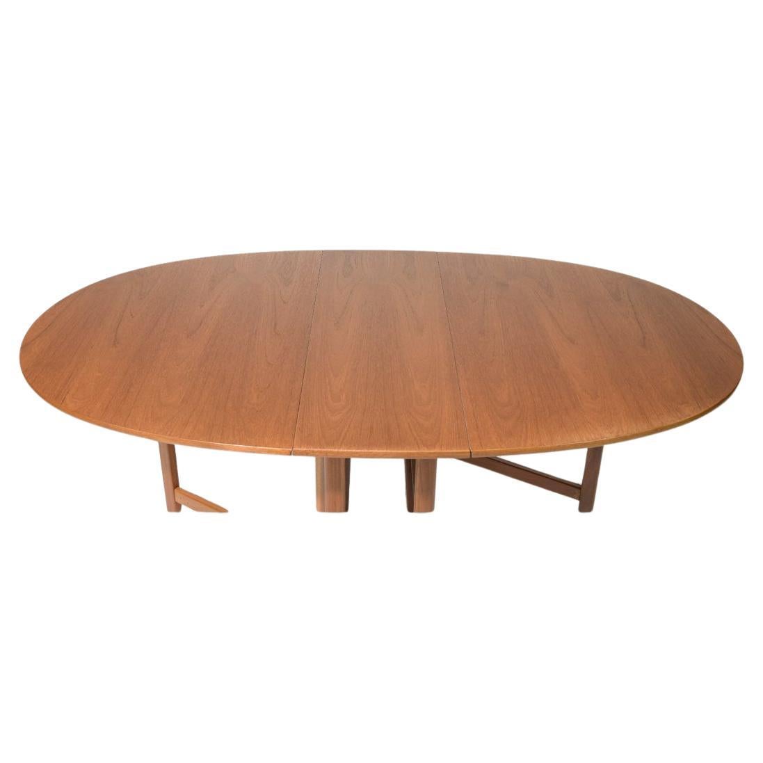 Danish Modern Teak oval Drop Leaf folding dining Table by Nathan Furniture made in Denmark. Very clean table with 2 fold down leaves ready for use. Seats 4-6 chairs Located in Brooklyn NYC.

Table folded is 39” wide x 13” deep x 29” tall 
Table