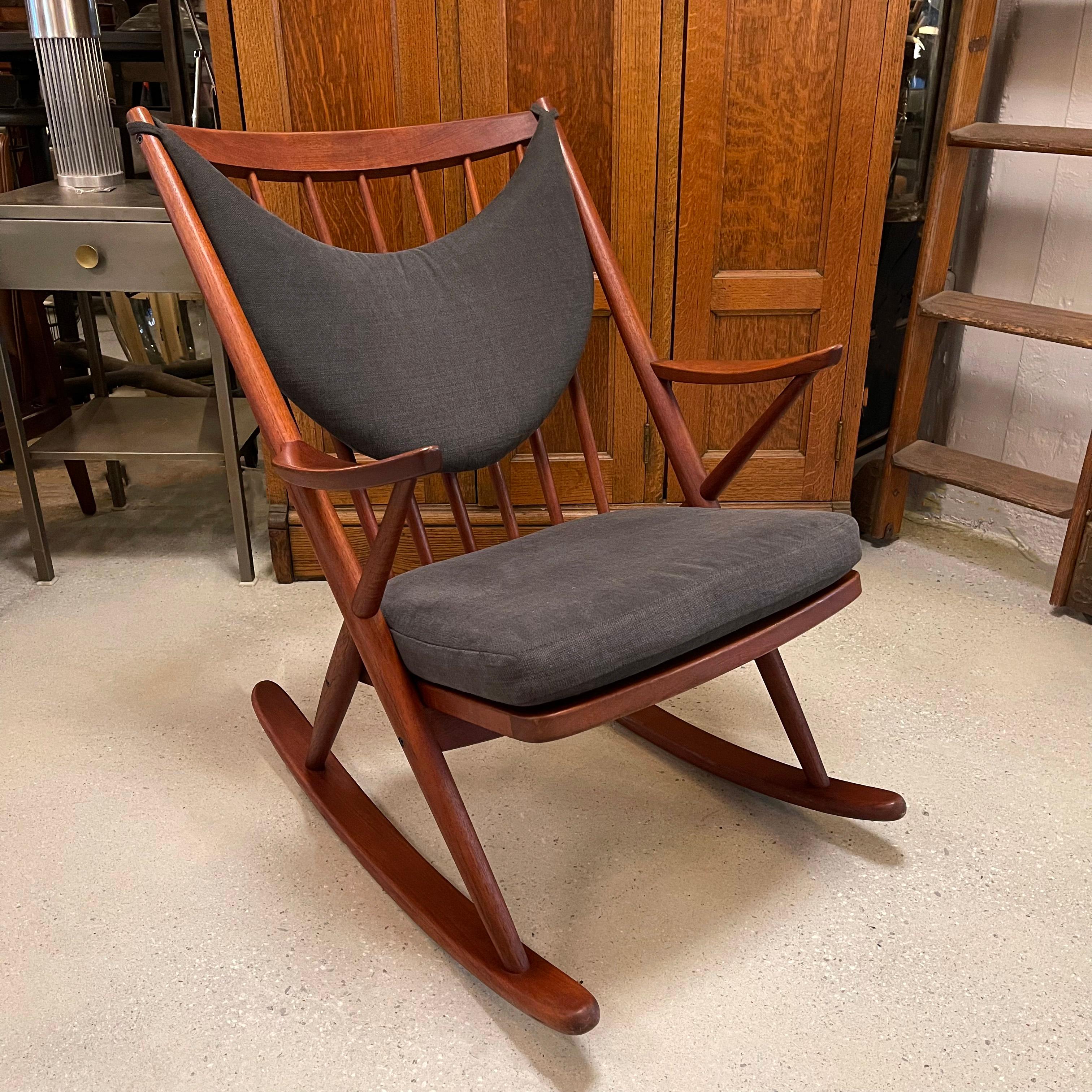 Danish modern, teak rocking chair by Frank Reenskaug for Bramin features a newly upholstered seat and back in gray brushed cotton.
 