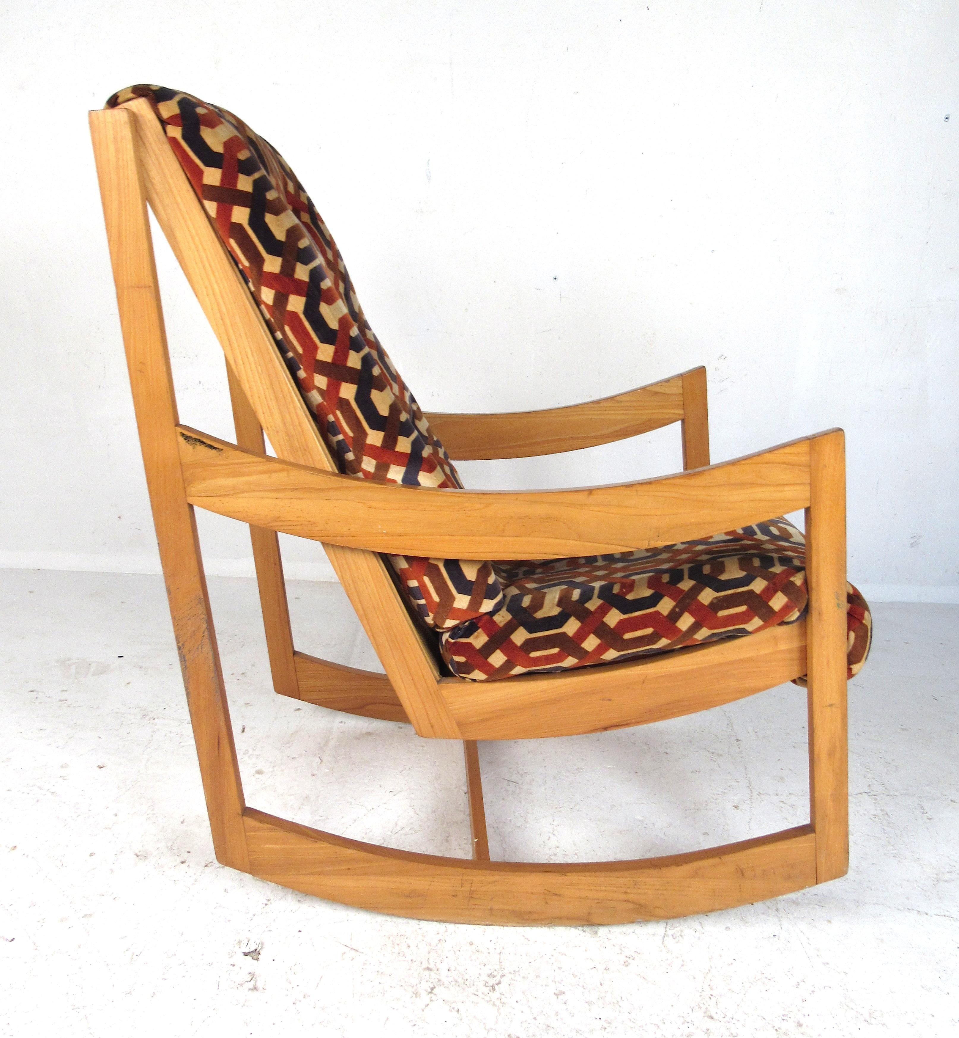 Mid-Century modern rocking chair with sculptural maple frame and geometric patterned upholstery. 
Please confirm item location (NY or NJ) with dealer.