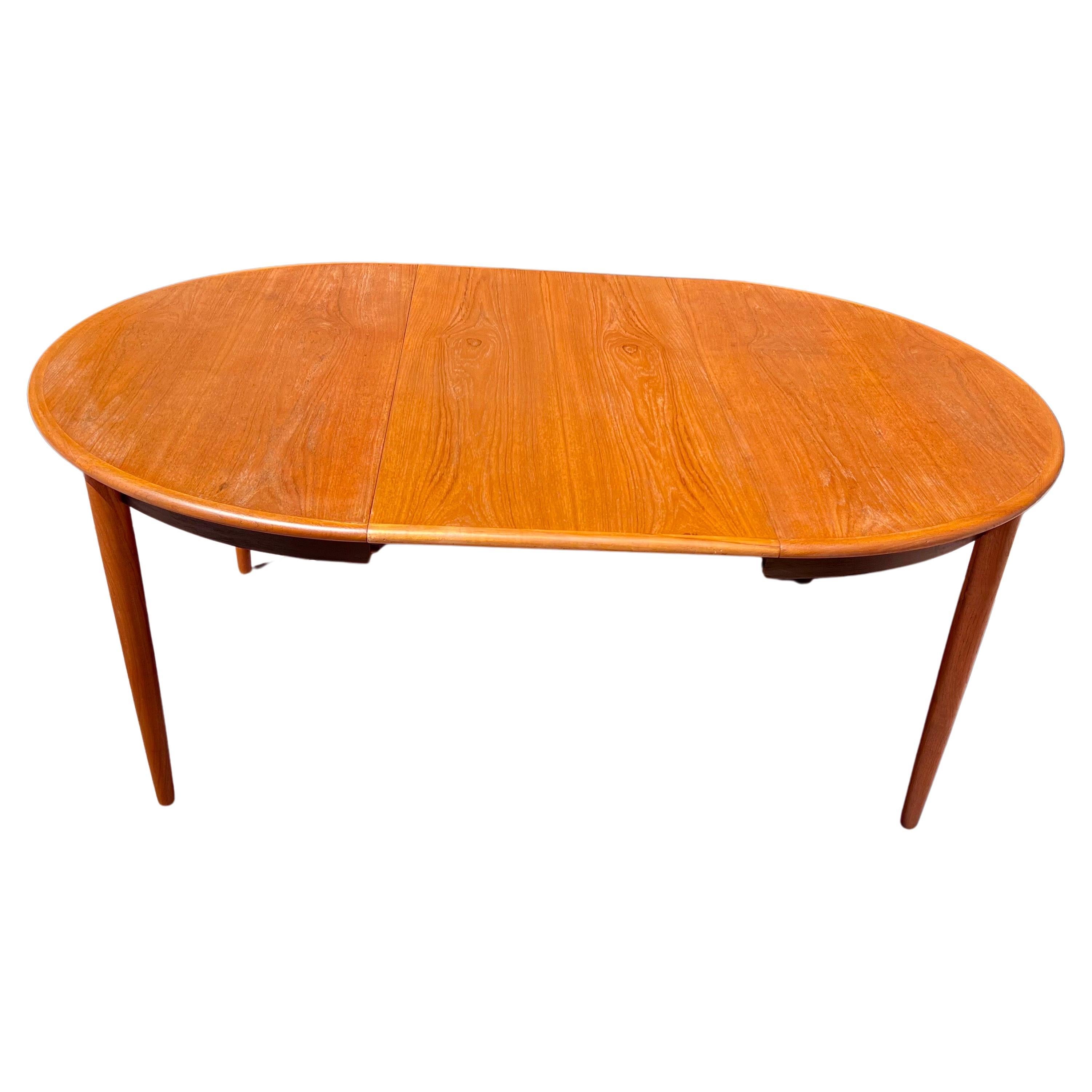 
Step into the timeless allure of mid-century Danish design with our stunning round/oval dining table, a masterpiece of craftsmanship and elegance. Crafted circa the 1950s, this exquisite piece embodies the essence of Danish modernism, celebrated