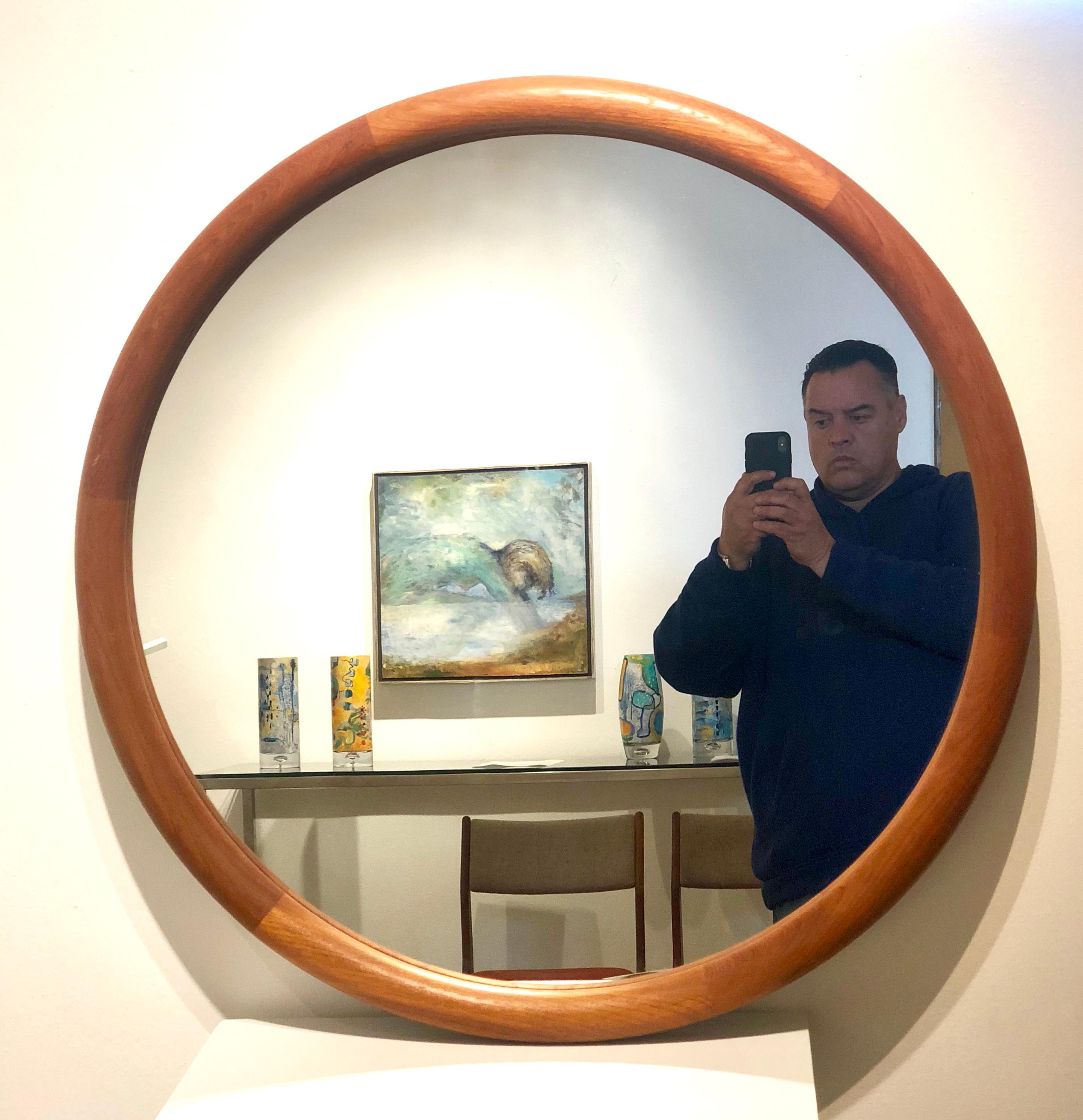 Beautiful Danish teak mirror freshly refinished easy to install not very heavy, solid round piping teak, circa 1970s great condition.