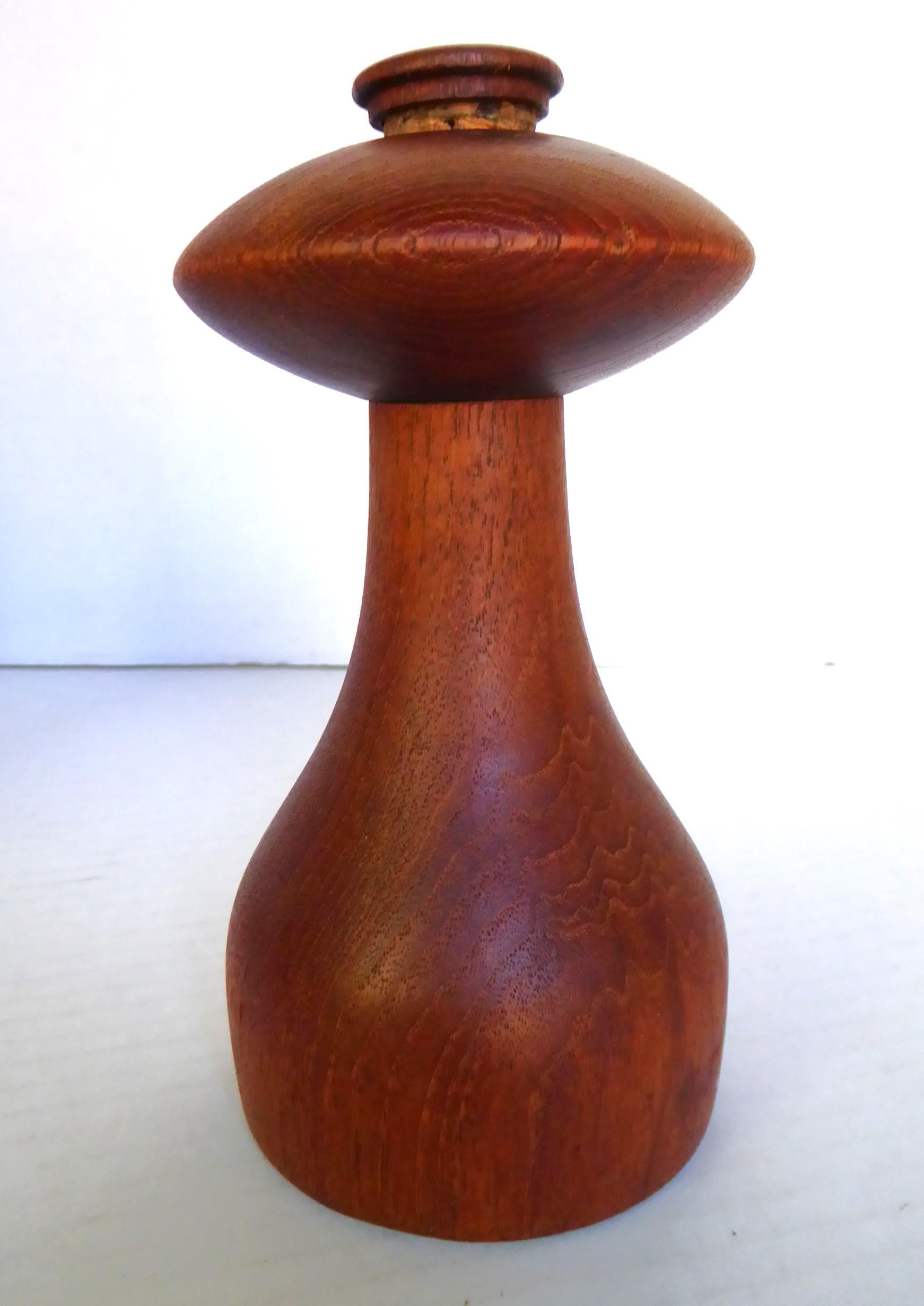 Great Mid-Century Modern teak mushroom shaped peppermill / salt shaker combo by Jens Harald Quistgaard for Dansk Designs. Ground pepper comes out of the bottom when top turns and salt sprinkles from top when placed upside down. Refill for salt is by