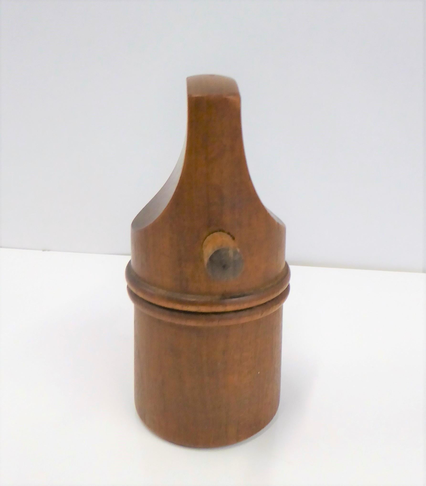 Great Mid-Century Modern teak peppermill / salt shaker combo by Jens Harald Quistgaard for Dansk Designs. Ground pepper comes out of the bottom when top turns and salt sprinkles from top when placed upside down. Refill for salt is by removing either