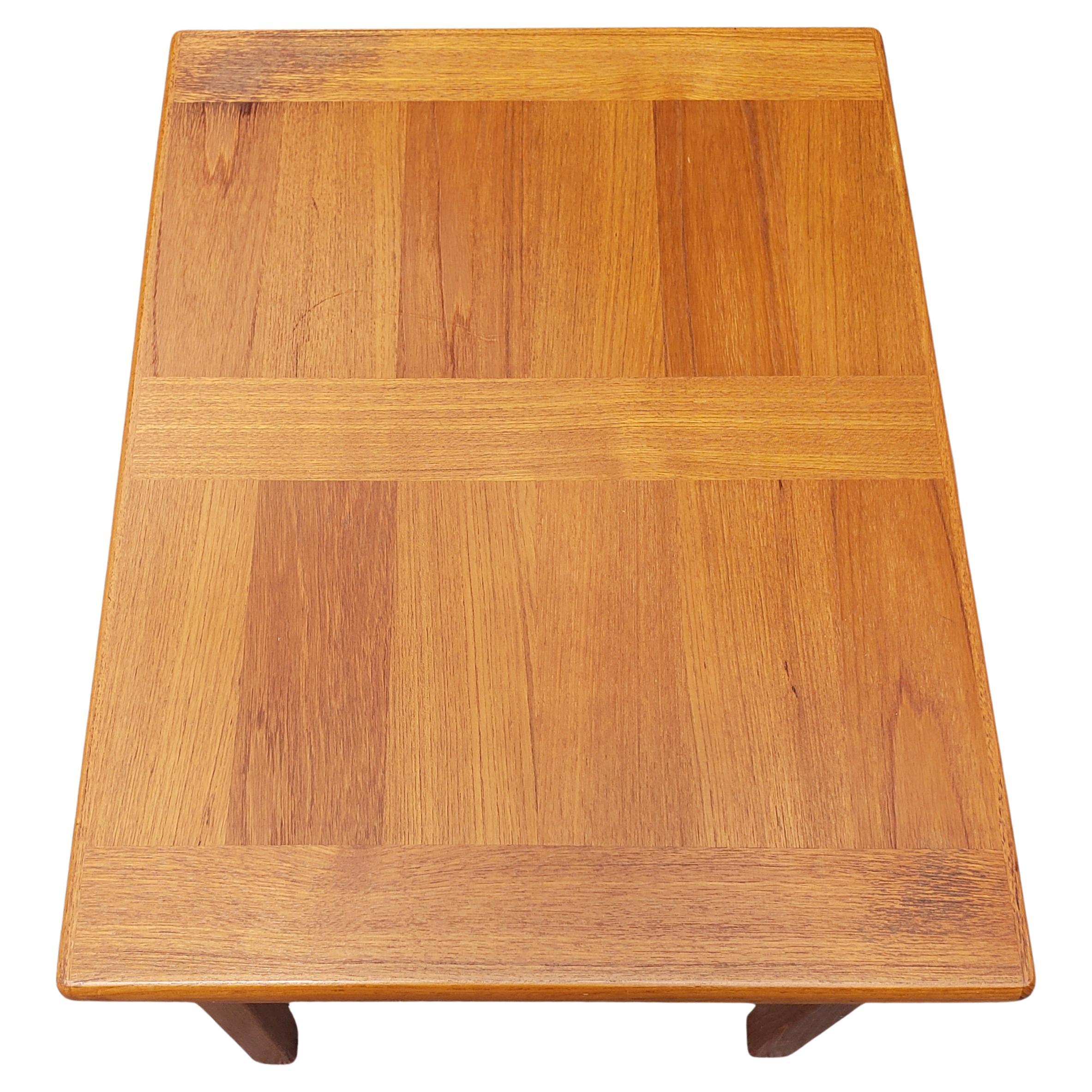 Danish Modern side table 
Manufactured by ABJ Denmark
The table has a rectangle measure that could fits in the corner between the Sofas or else.
Measures 22
