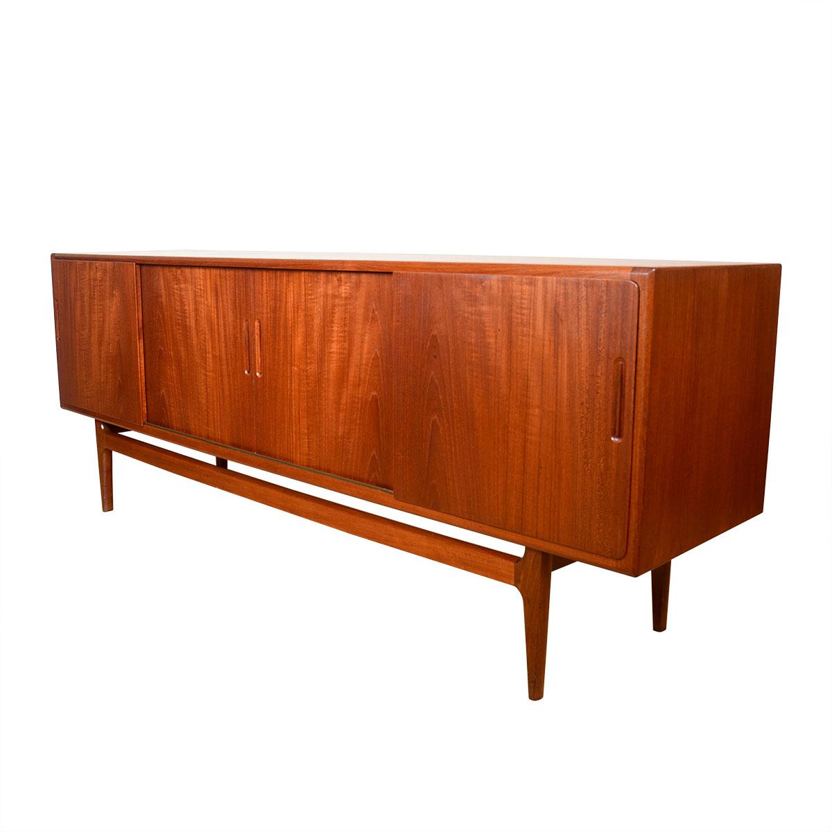 Danish Modern Teak Sideboard with 4 Sliding Doors, 1950s

Additional Information:
Material: Teak
Featured at DC:
Gracious & refined, this serene Danish sideboard features 4 sliding doors across its front.
Inside a column of shallow drawers is