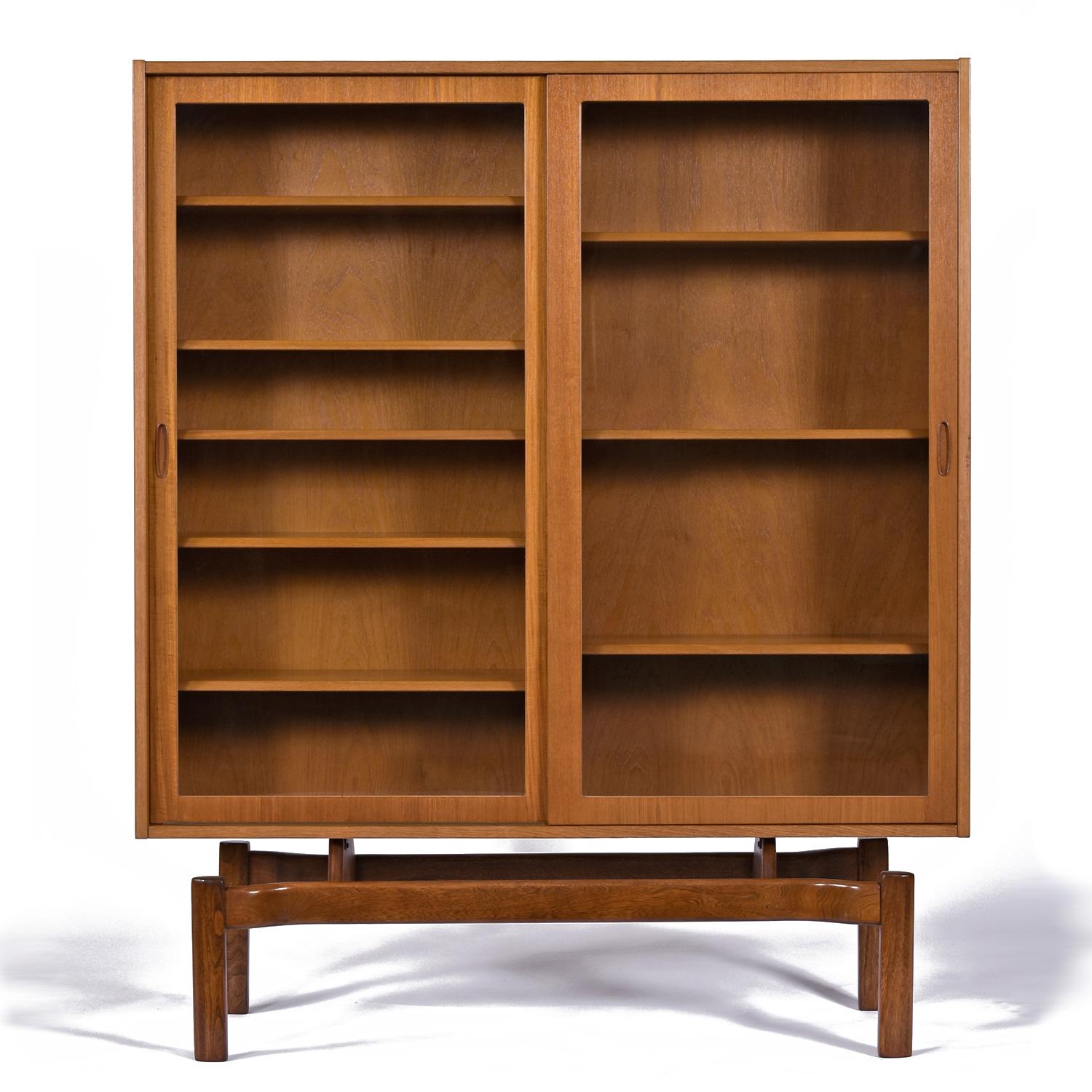 Mid-Century Scandinavian Modern Danish Teak Hutch by Poul Hundevad.  This one-of-a-kind creation is a FMV original.  We married the cabinet with a sinuous base that was harvested from another piece from many years back.  We've waited for just the