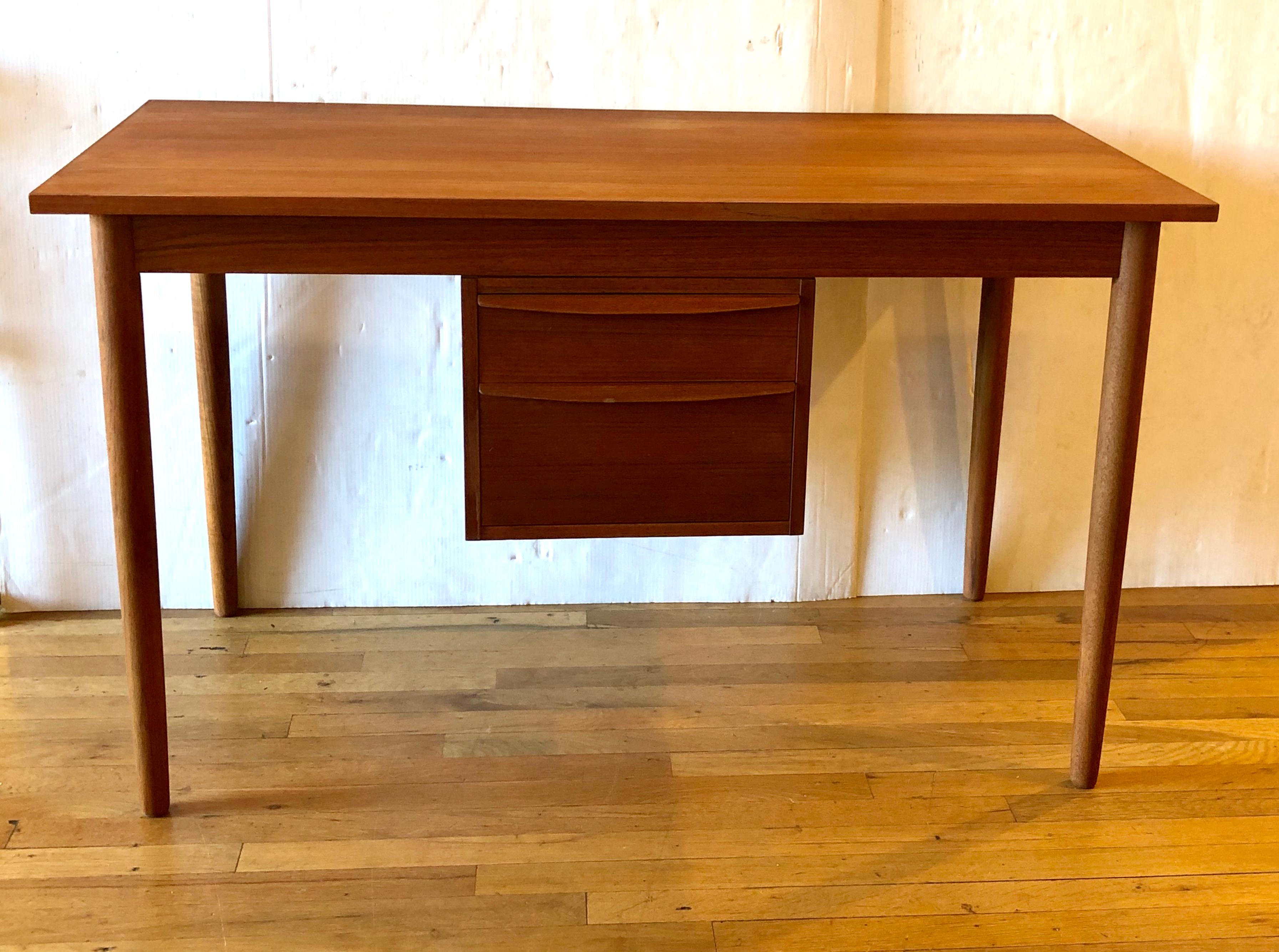 Versatile teak Danish desk made by Art Furn from Denmark, great condition with light wear we refinished and oiled the desk, the drawers slide from side to side for left or right preference, its also finished in the back.