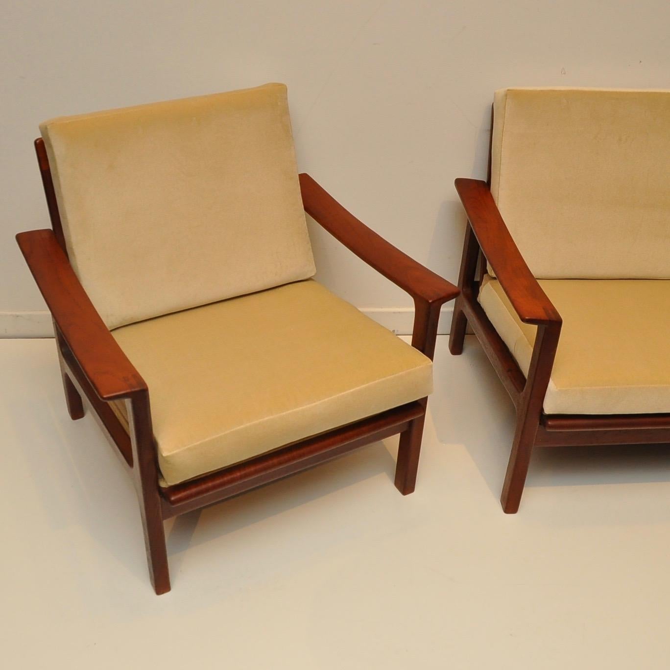 Nice clean Danish modern set in solid teak. New cushions, including foam, and new webbing underneath fabric panels on chair/sofa frames. Fabric is a light beige velvet. Chair dimensions are: 29.25
