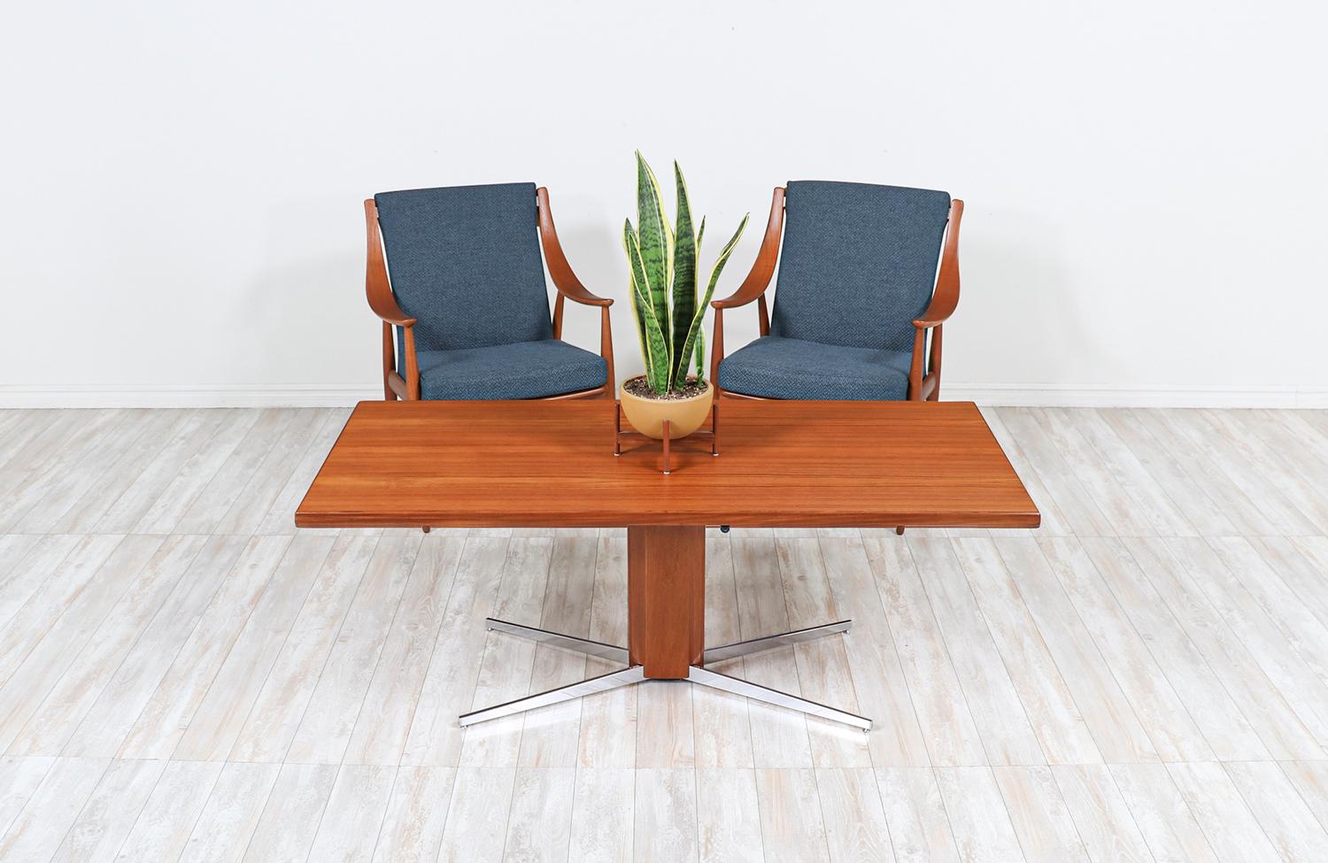 Danish modern teak and steel adjustable table / desk.

________________________________________

Transforming a piece of Mid-Century Modern furniture is like bringing history back to life, and we take this journey with passion and precision. With