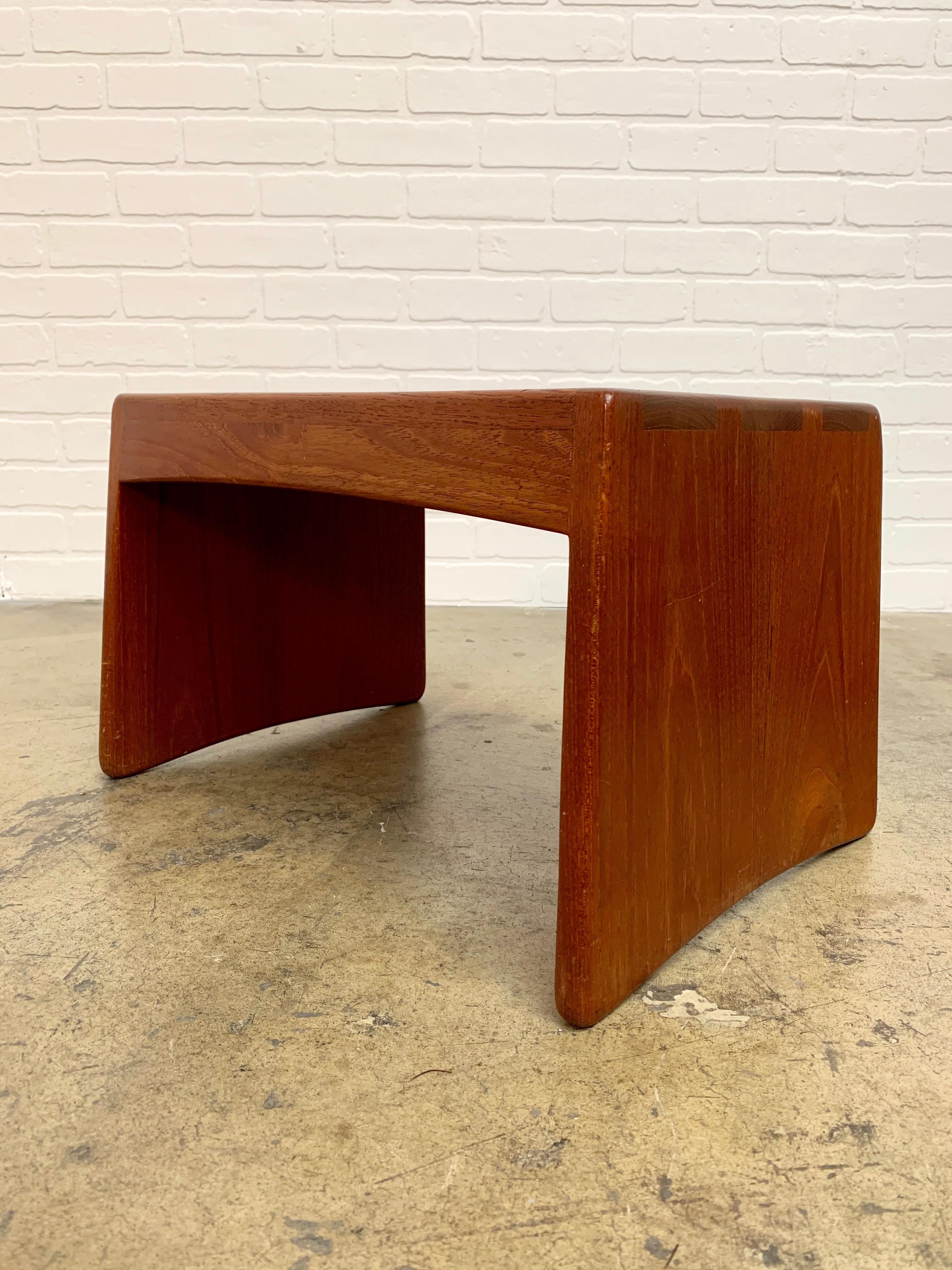 Solid thick teak wood with dovetailed corners can be also used for a side table.