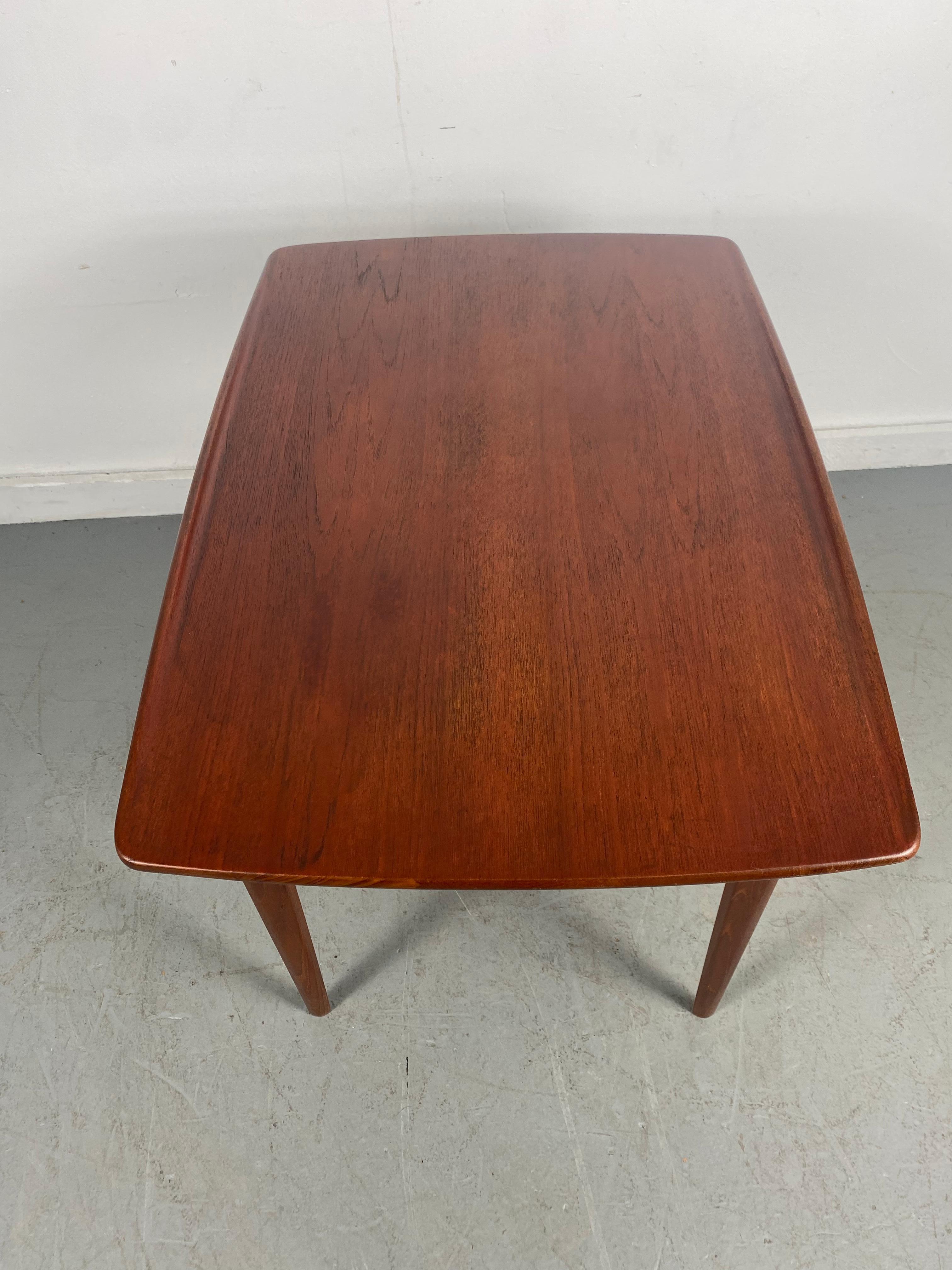 Danish Modern teak table by Finn Juhl for France and Sons,,, Classic Scandinavian modernist design..Retains original France and Sons badge / label.. Superior quality and construction..