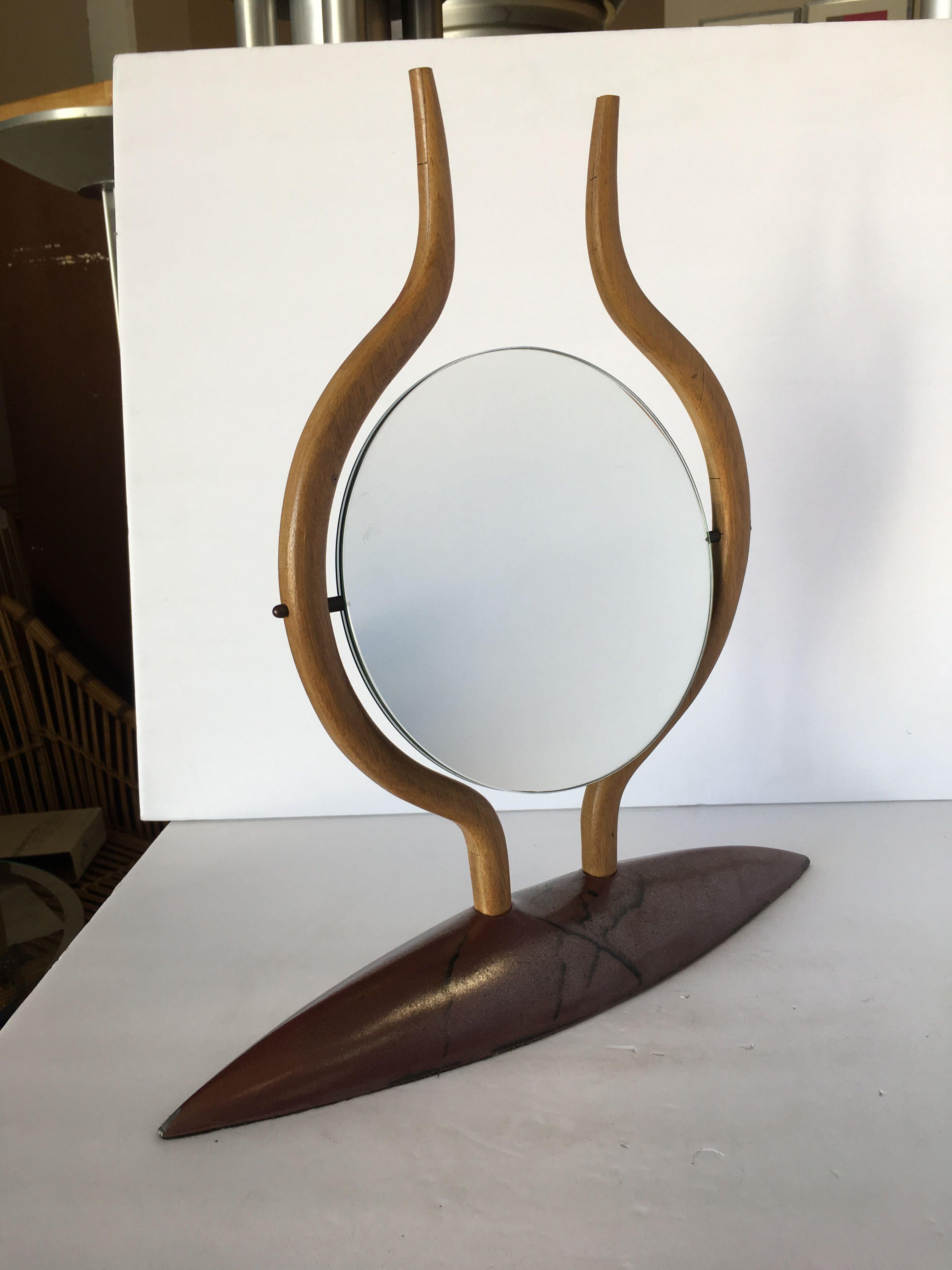 Vintage Danish modern teak tabletop vanity mirror with double sided reversible mirror featuring a normal mirror on one side and a magnified mirror on the other.
 