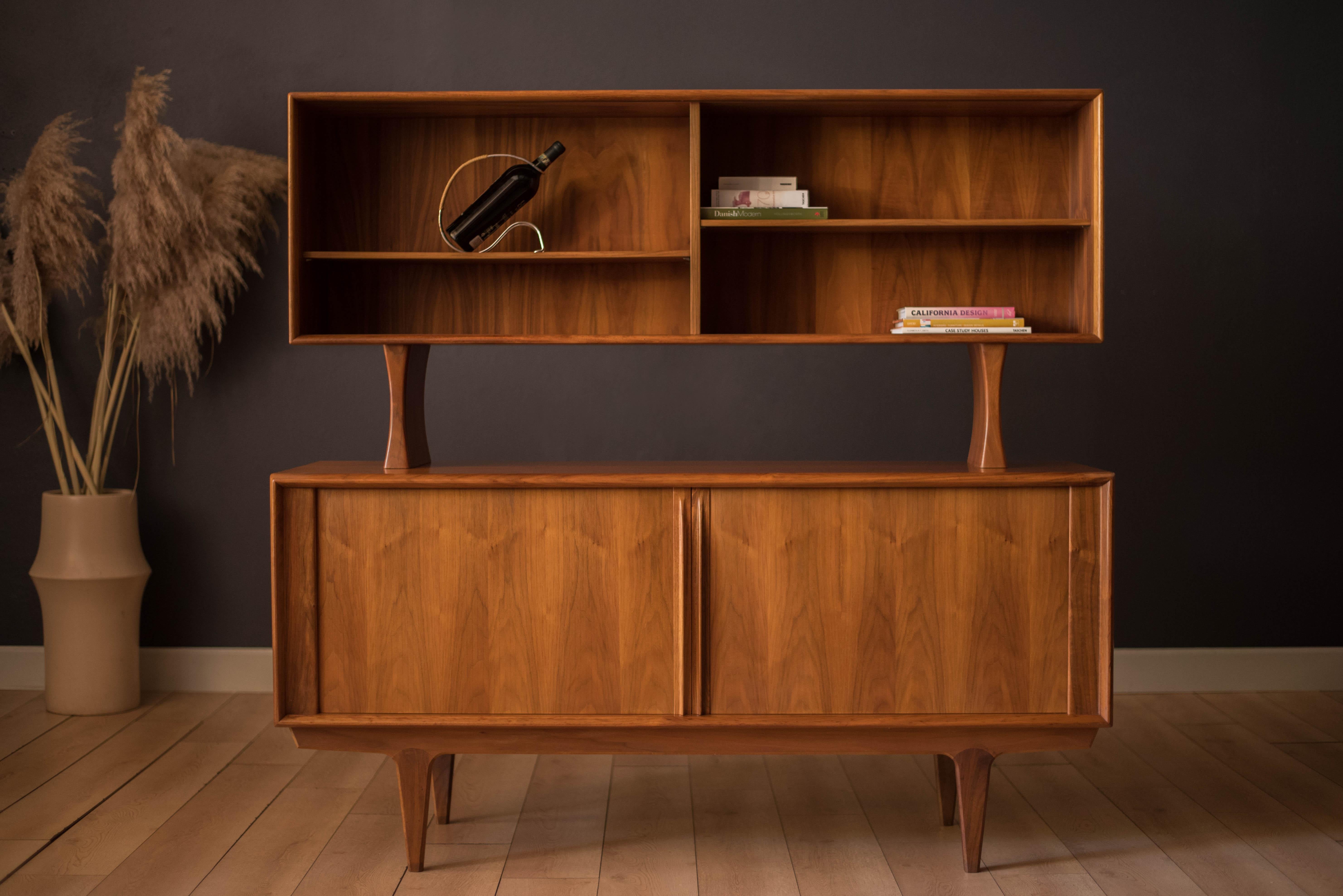 Mid Century Modern two-piece credenza sideboard and hutch in teak manufactured by Bernhard Pedersen & Søn, Denmark. Features sliding tambour doors with signature sculpted handles. Interior storage provides three dovetailed drawers and adjustable