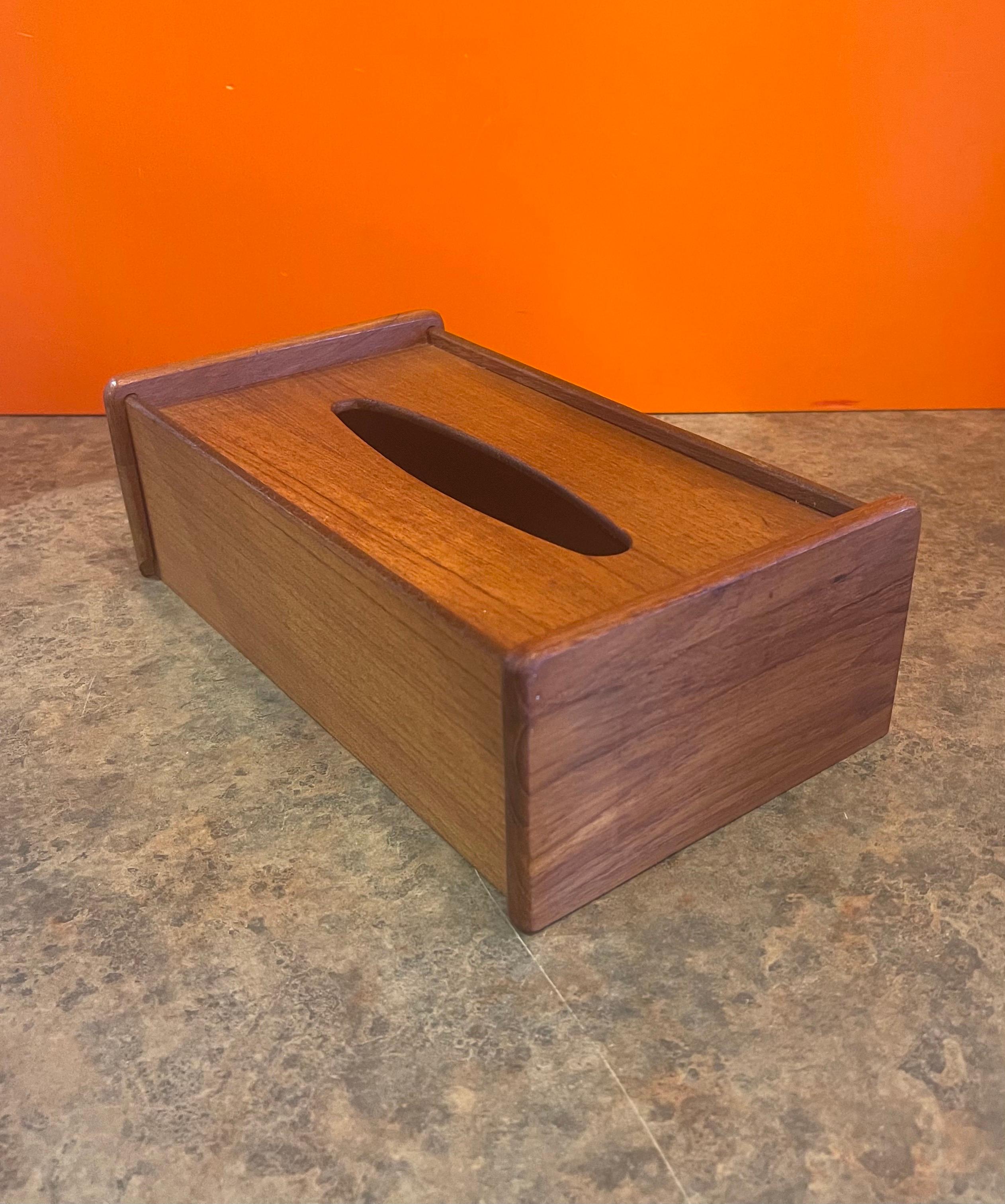 A very nice Danish modern teak tissue box cover, circa 1970s. The box is in very good vintage condition and measures: 10.5