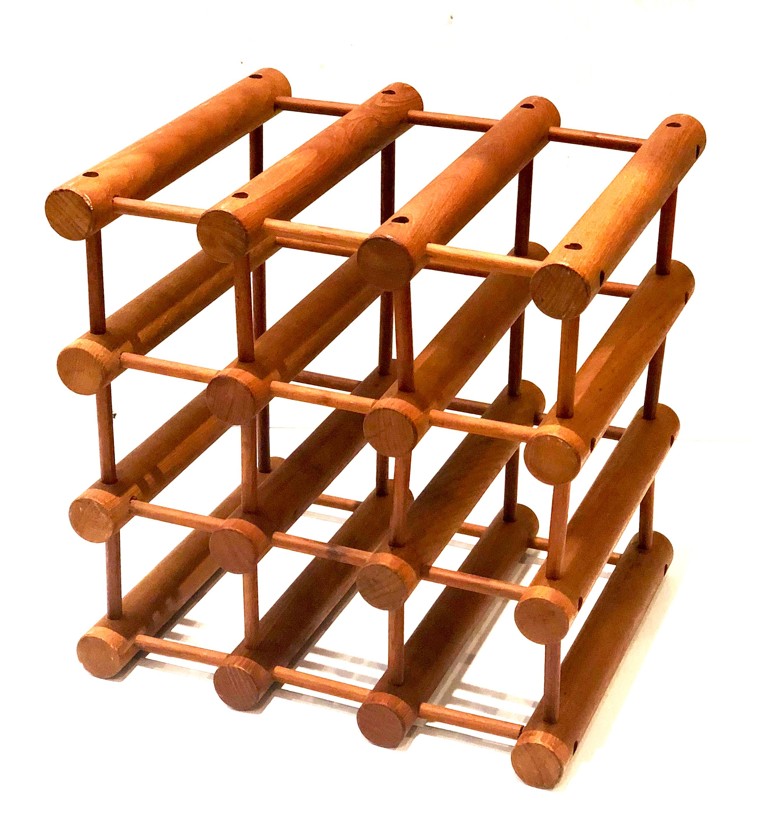 Versatile solid teak twelve bottle wine rack by Nissen Langaa, circa 1960s with nine bottles on the bottom and three on top perfect for a small place.