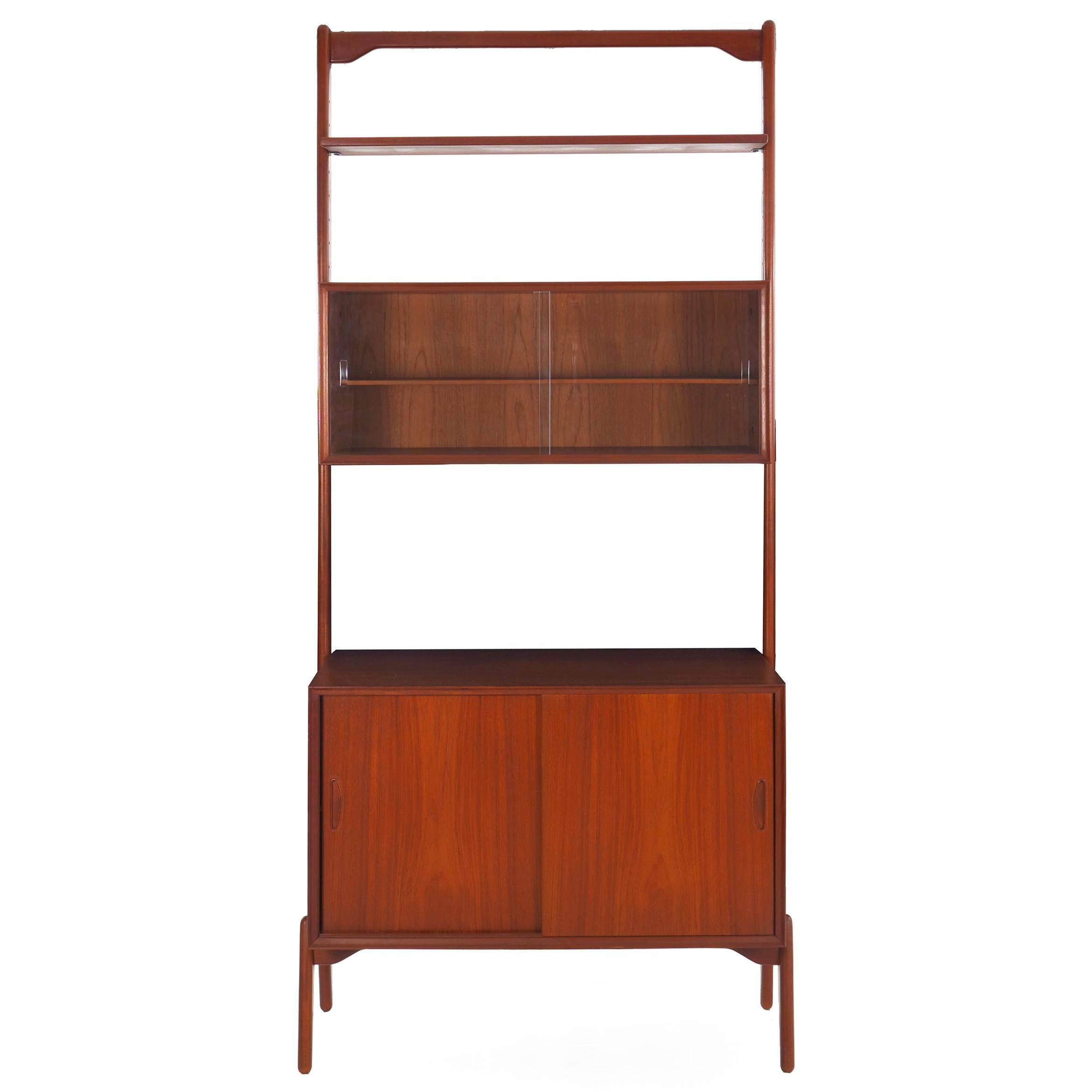 A fine modular and adjustable bookshelf system designed by Erik Buch (sometimes spelled Buck) in the 1960s, it is unlabeled by a well-documented design from his 