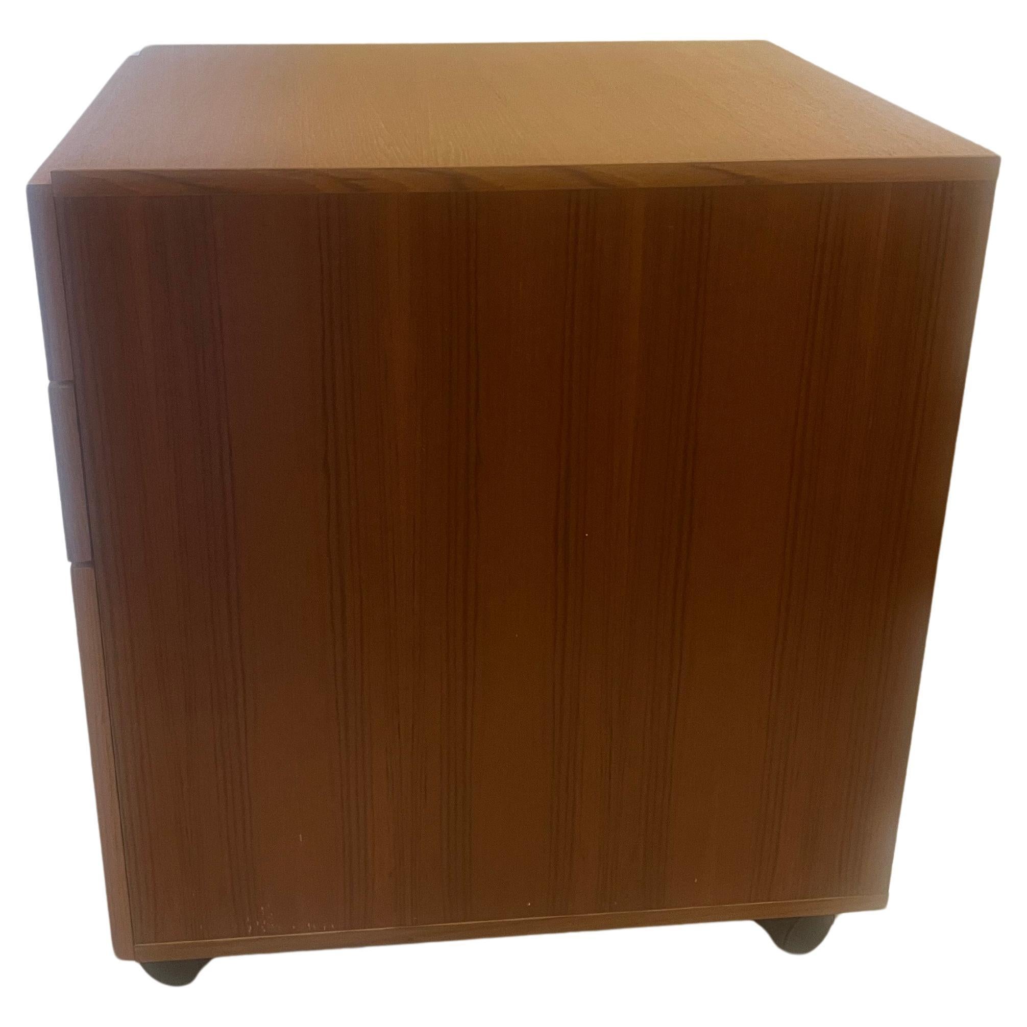 Versatile teak and rosewood handles file cabinet on casters very clean and nice condition circa 1980's a postmodern look .