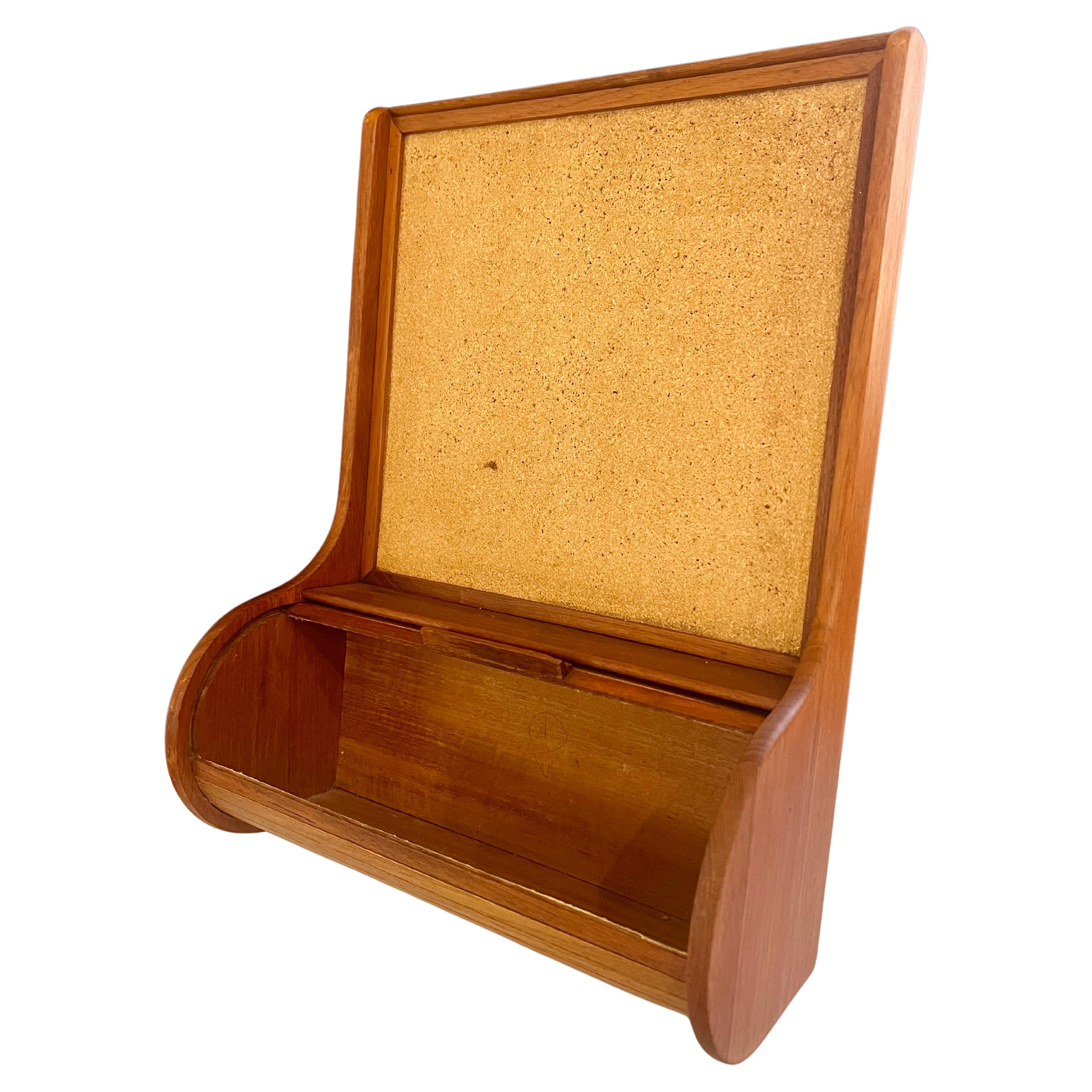 A unique Danish solid teak wall hanging roll top trinket box, and memo pad with cork circa 1970's, versatile rare, and unique perfect for mid century, danish modern home decor.