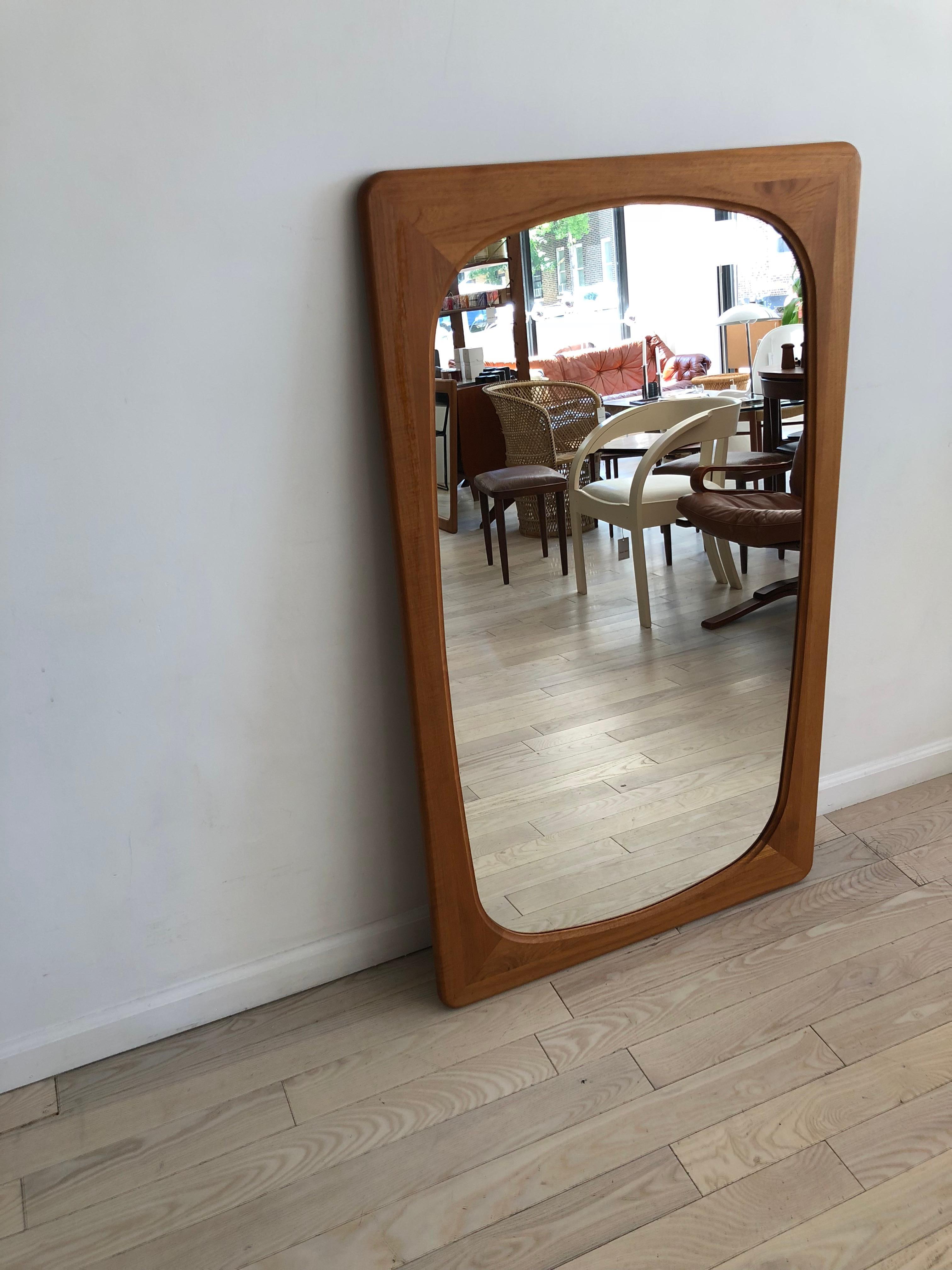 Beautiful 1960s, full sized Danish modern teak mirror for Fakse Furniture. Finely crafted teak wood frame, pretty joinery and teak grain. Large glass mirror is exceptionally clean, with no scratches. Hardware on the back allows for easy wall hanging