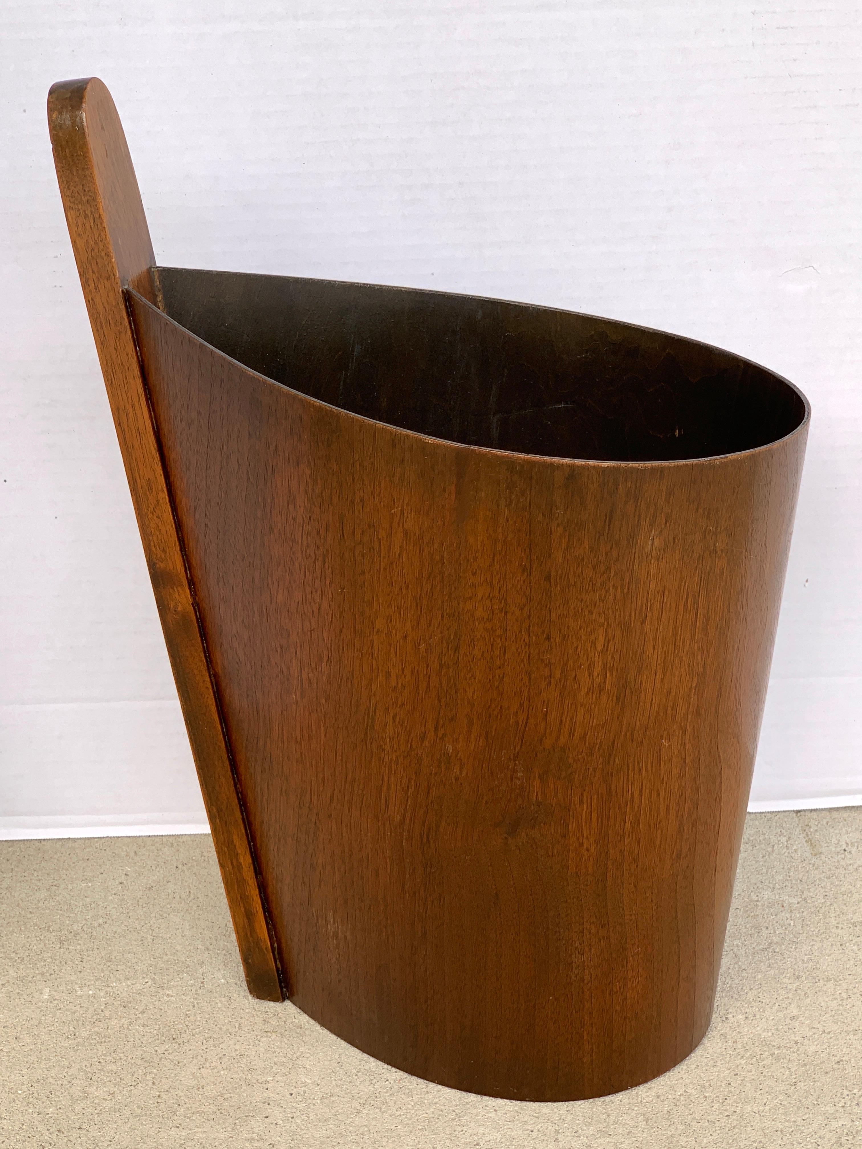 Danish modern teak and walnut wastepaper basket, by P. S. Heggen. An early 1950s example, of exceptional design, with extended handle 18.5