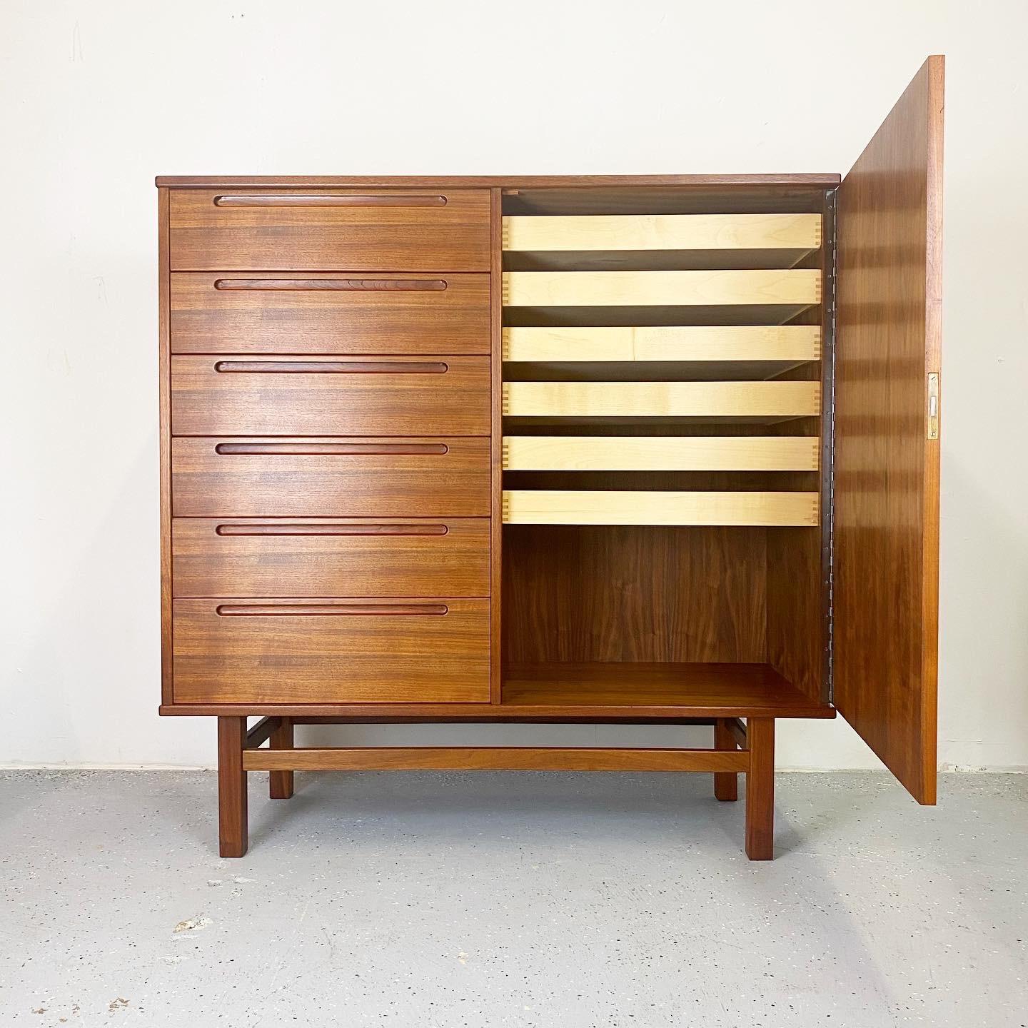 Incredible oiled teak chest by Nils Jonsson with six drawers and a door concealing six smaller birch drawers. Wonderful minimalist design with a plethora of storage.