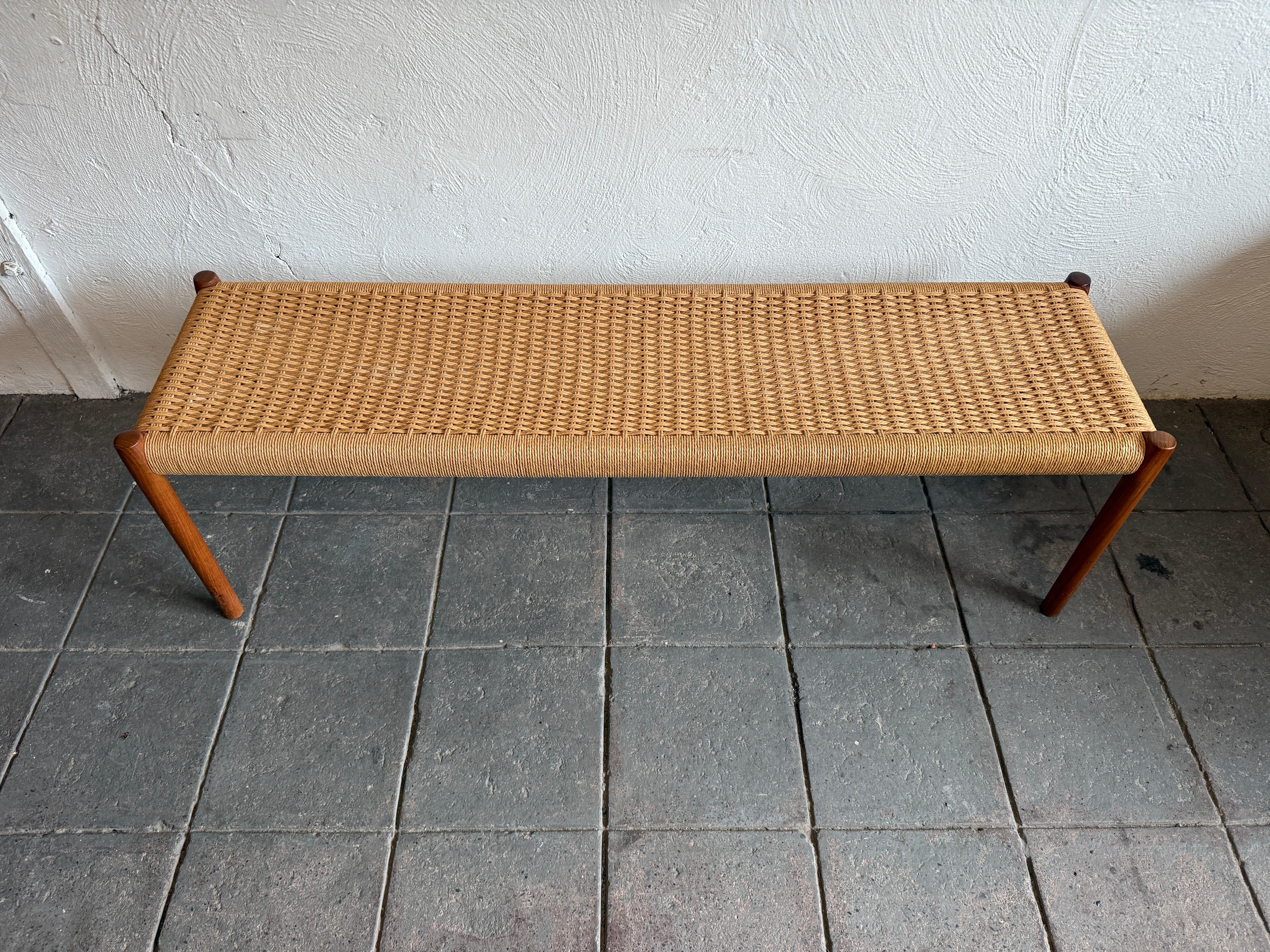 Danish Modern teak woven Model 63 Bench by Niels Otto Møller for J.L. Moller. Vintage Woven bench with oak frame and teak round legs. Very minimalist Danish modern design in great vintage condition. Ready for use. Made in Denmark. 

Local pick up