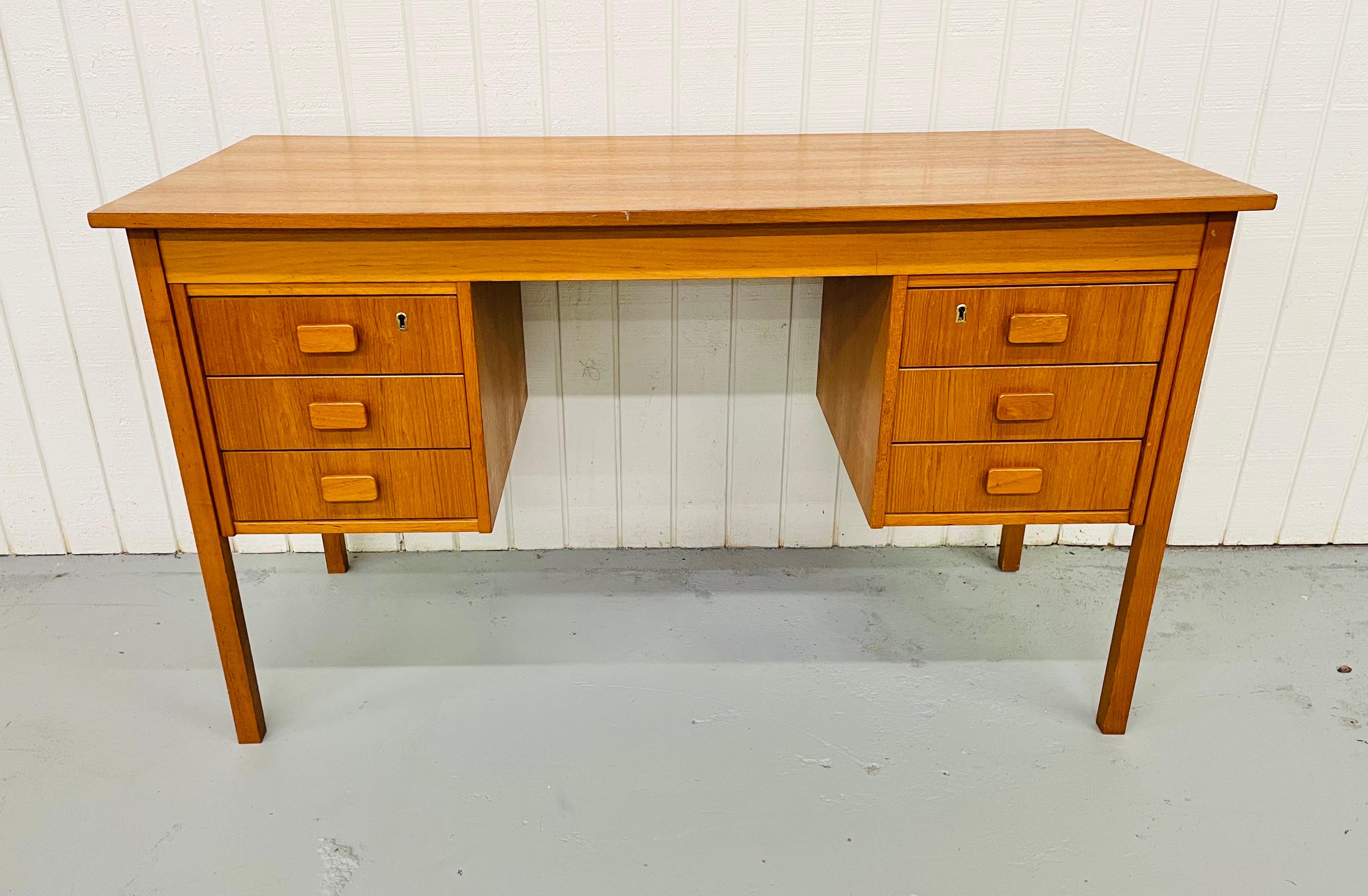 This listing is for a beautiful Danish Modern teak writing desk! Featuring six drawers for storage, sculpted wood pulls on each drawer, and a large top with plenty of space for work or school!.