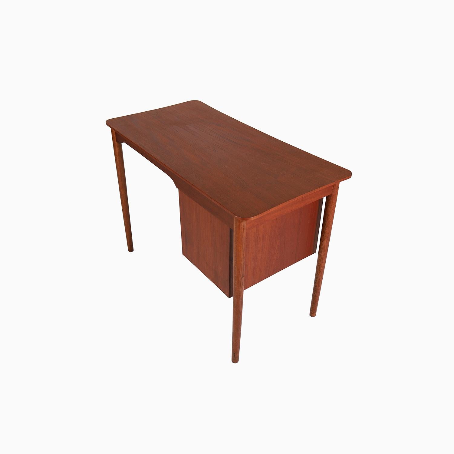 20th Century danish modern teak writing desk with curvilinear top For Sale