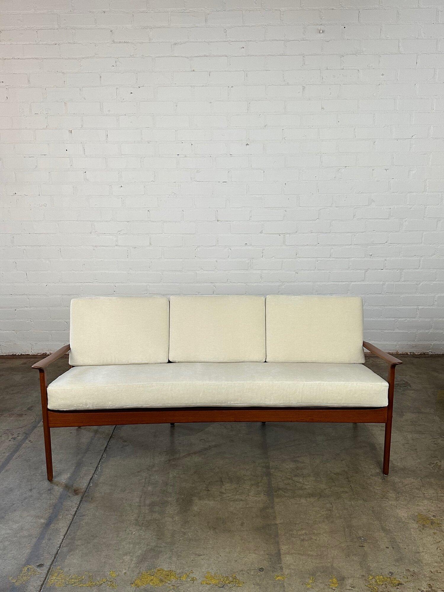W71 D27 H30 SW65 SD18 SH20 AH24

Teak Danish Modern three seater sofa. Item has no major areas of wear and has been fully restored. Item features a solid teak refinished frame. Cushions have new foam and new off white mohair. Sofa is structurally