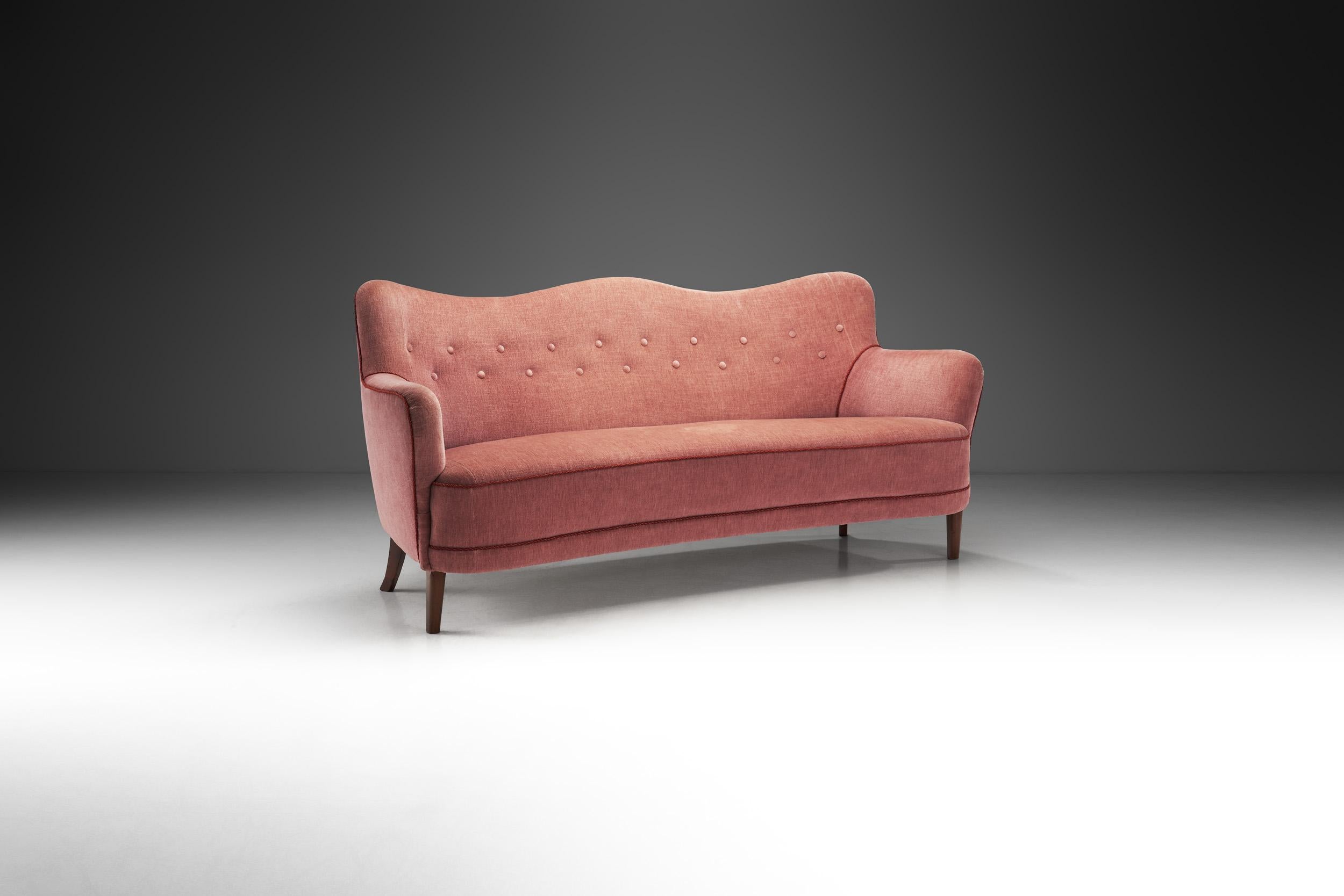 “Danish Modern” is a recognized term around the world standing for the characteristic style of Danish design created during the 20th century. As this elegant three-seater sofa shows, the style is characterized by clarity in design and extremely high