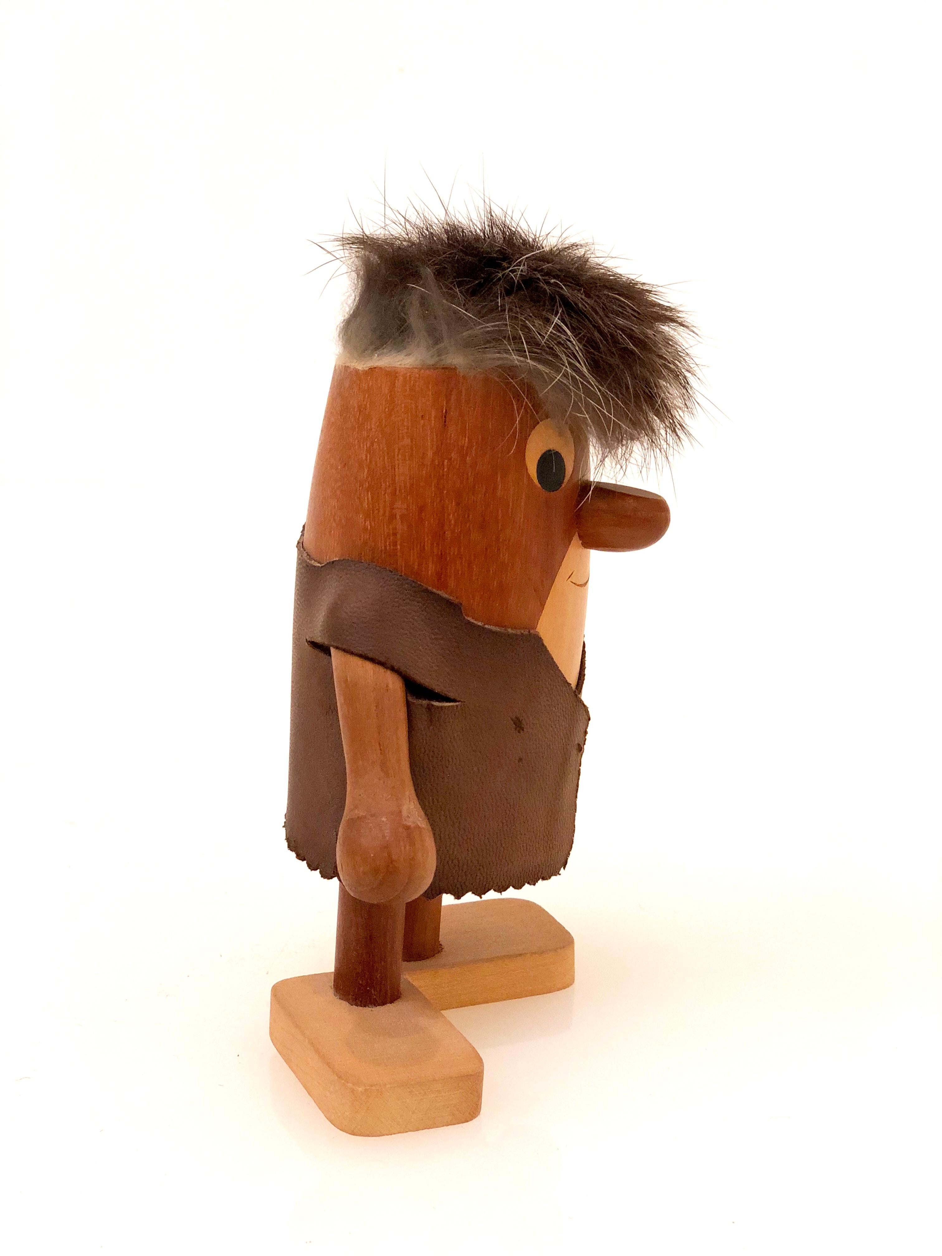 Rare and cool Fred Flintstone teak wood toy sculpture, by Danish artist Arne Basse, commission by Hanna Barbera Productions circa 1970s stamped.

 