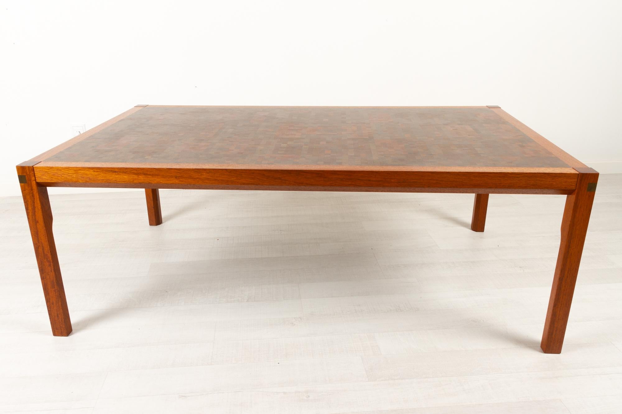 Danish modern tranekær coffee table, 1970s
Designed by Rolf Middelboe og Gorm Lindum for Tranekaer Møbler in the 1970s.
Large handcrafted table with frame and legs in solid teak with bevelled edges. Top is made from hundreds of small blocks of