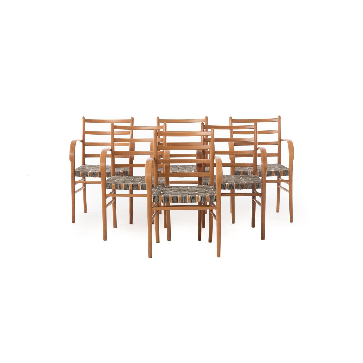Built of European beechwood; these rare Viggo Sten Møller Scandinavian modern dining chairs feature a woven graphic seat made out of a black and cream hemp webbing. These fully restored Danish modern dining room chairs are a stylish choice for