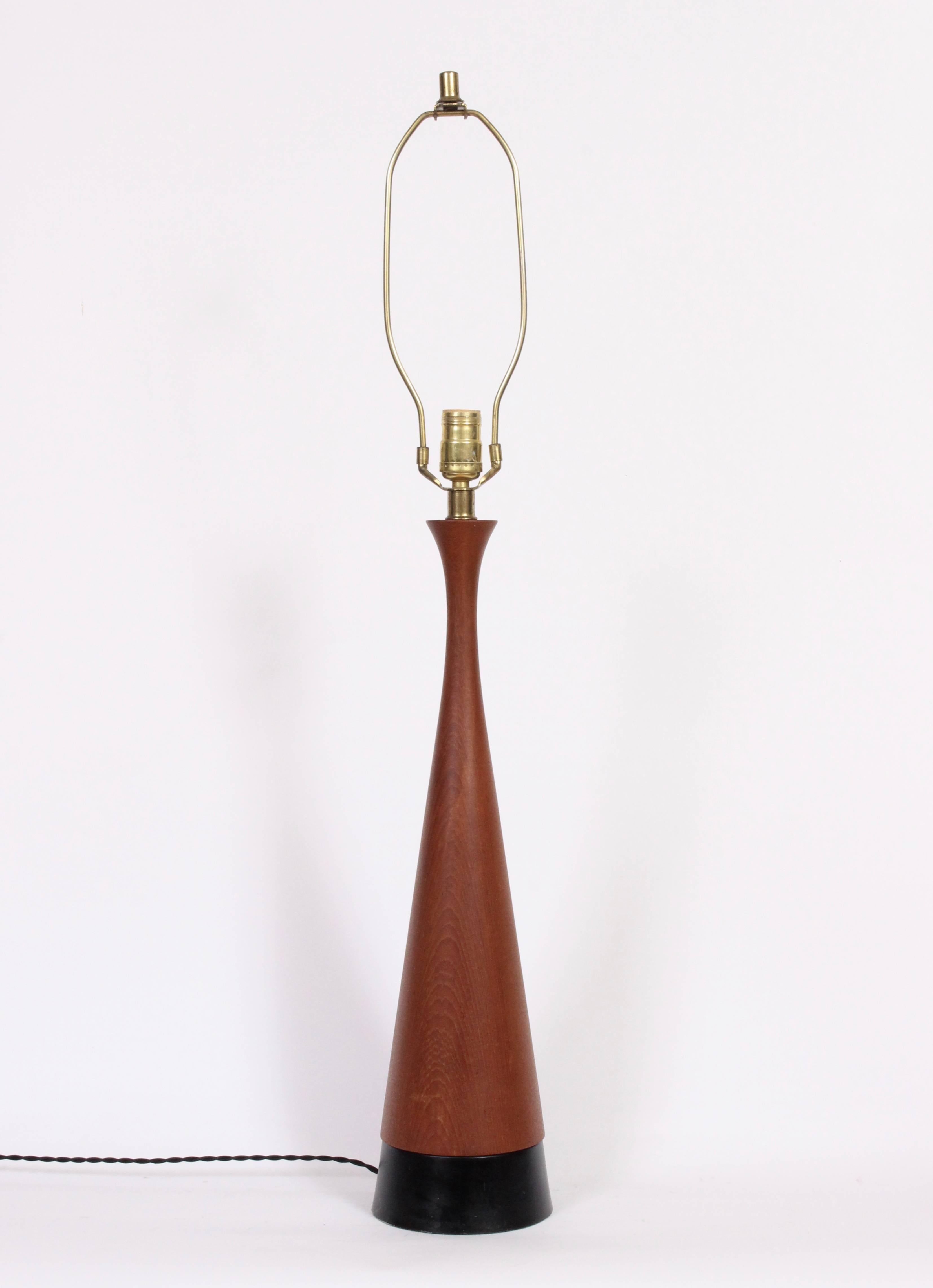 Substantial Danish Modern 3'H Diabolo Turned Teak Table Lamp with Black enameled base.  Featuring a beautifully grained smooth form with small footprint for height. 25.5 H to top of socket. Shade shown for display only and not for sale (10 H x 13 D