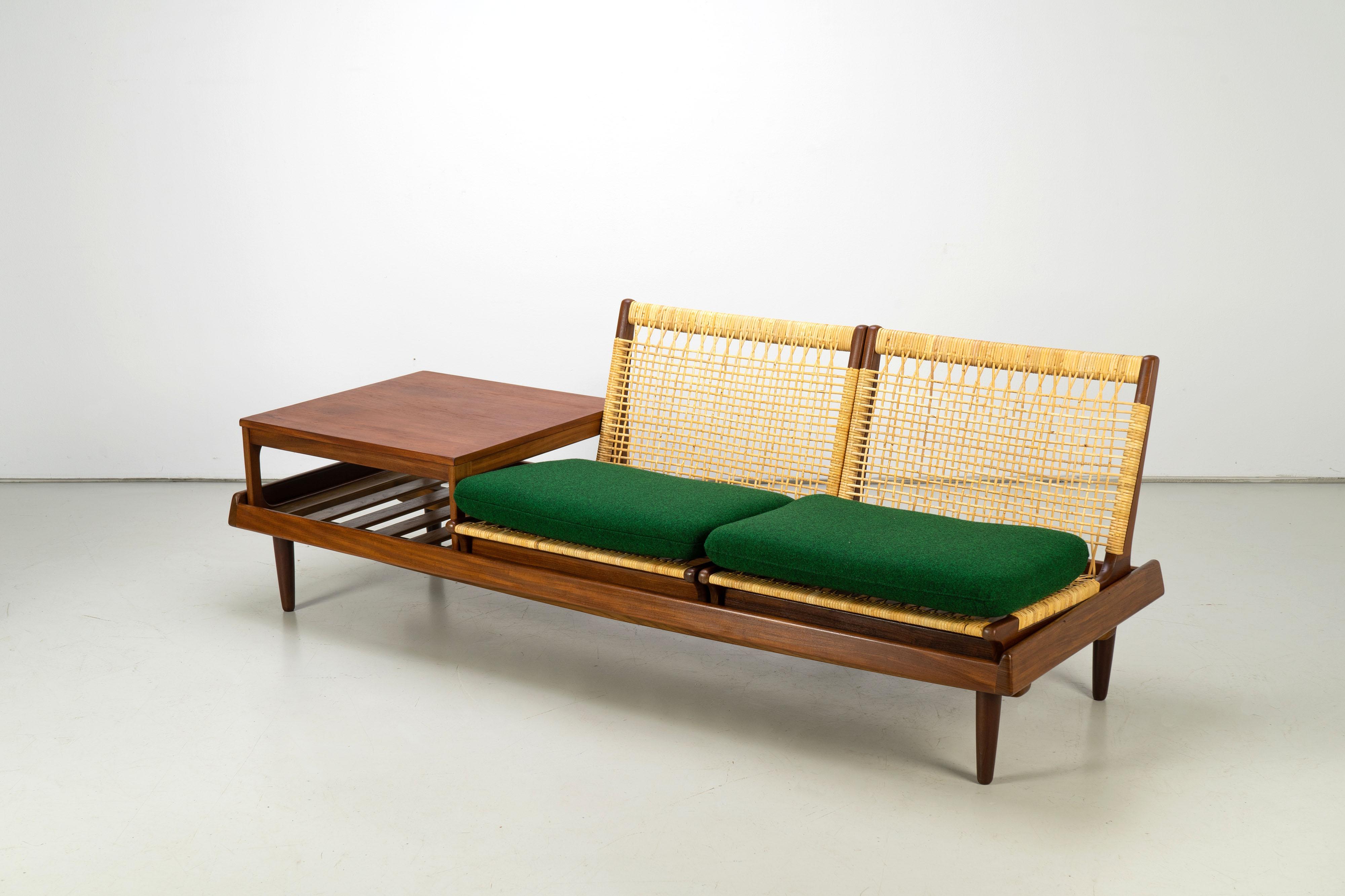 Modular teak TV bench model 161 by Hans Olsen for Bramin, Denmark. The set consists of a bench, two seating modules and a table. We have two full sets in stock that can be used as a corner combination.