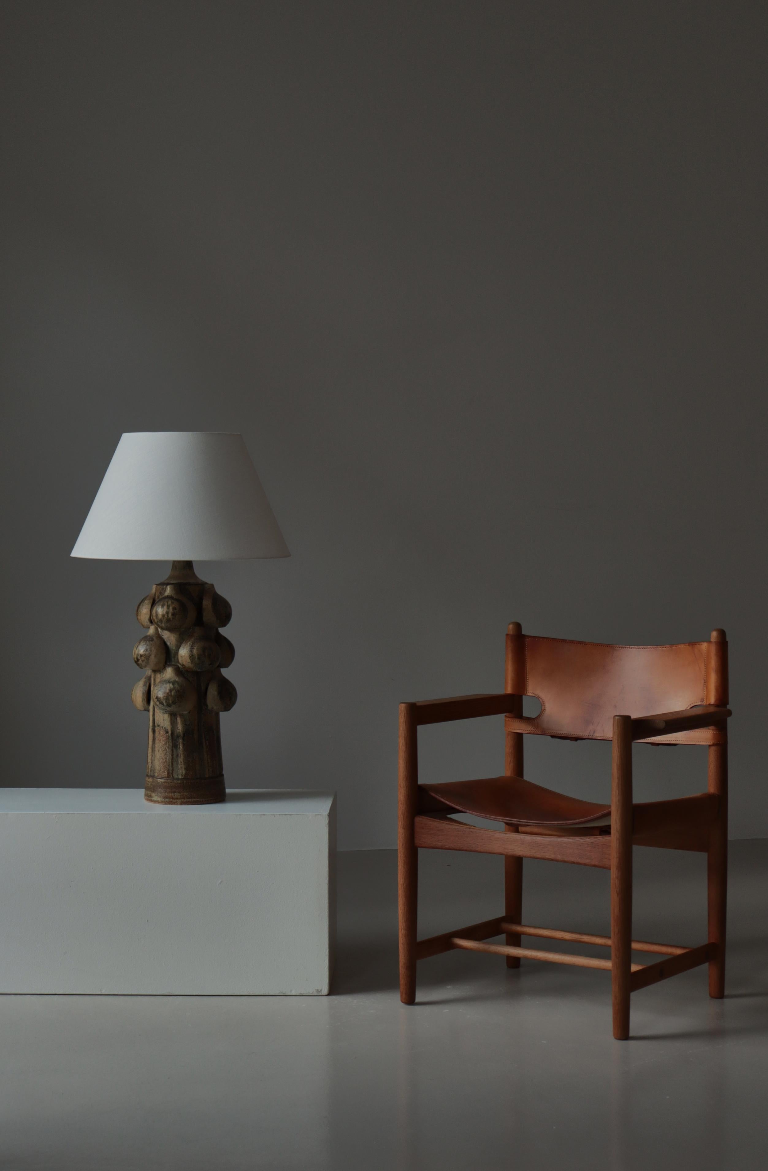 A unique handmade stoneware table lamp designed and signed by Noomi Backhausen for Søholm Stentøj in the 1960s. This sculptural piece showcases Backhausen’s distinctive ceramic language—organic, tactile, and richly textured—while embodying the warm,