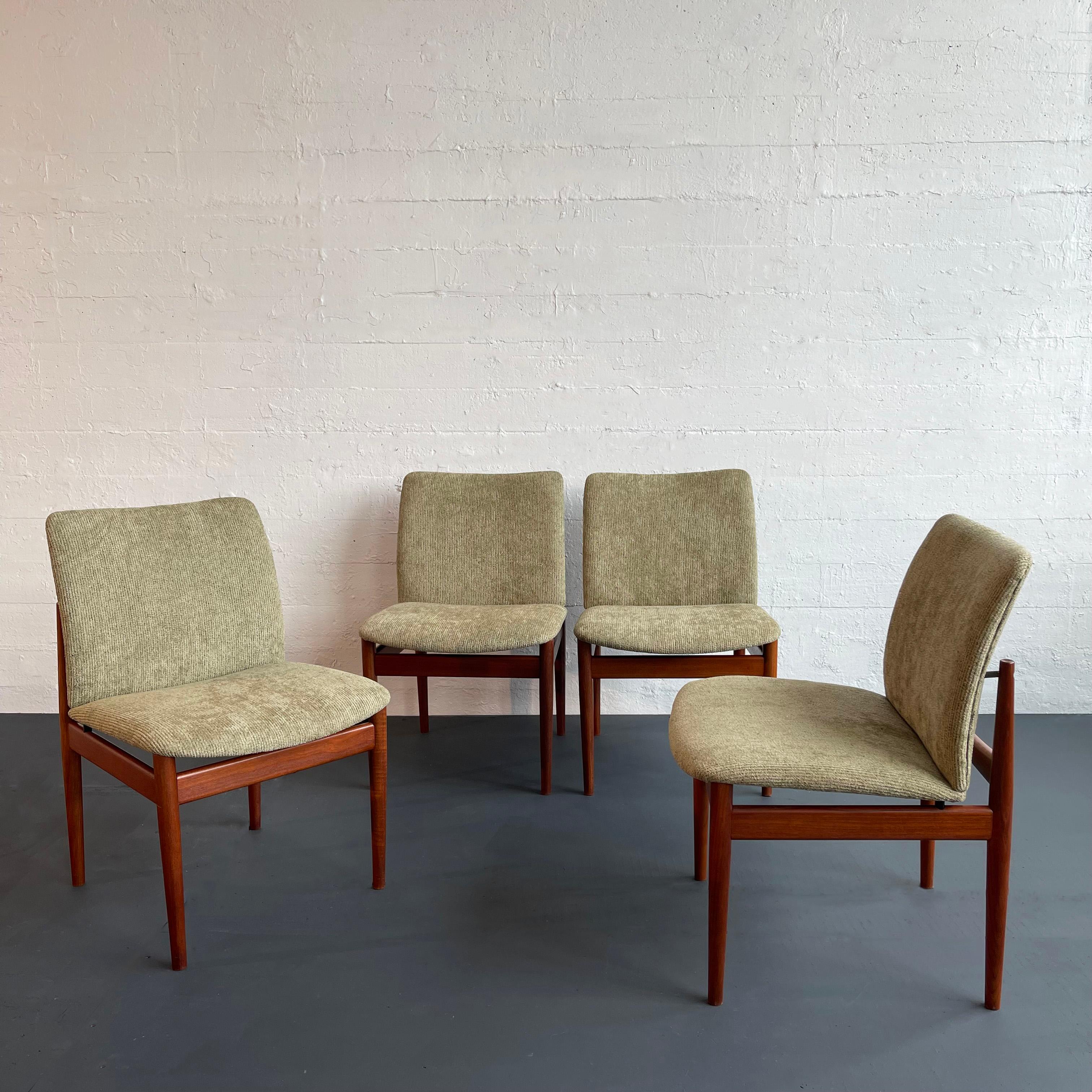 Set of four, Danish modern, model 191, upholstered dining chairs, designed by Danish designer Finn Juhl for France & Søn and retailed in the US by John Stuart features seats that appear as though they are floating within the minimal teak frames. The