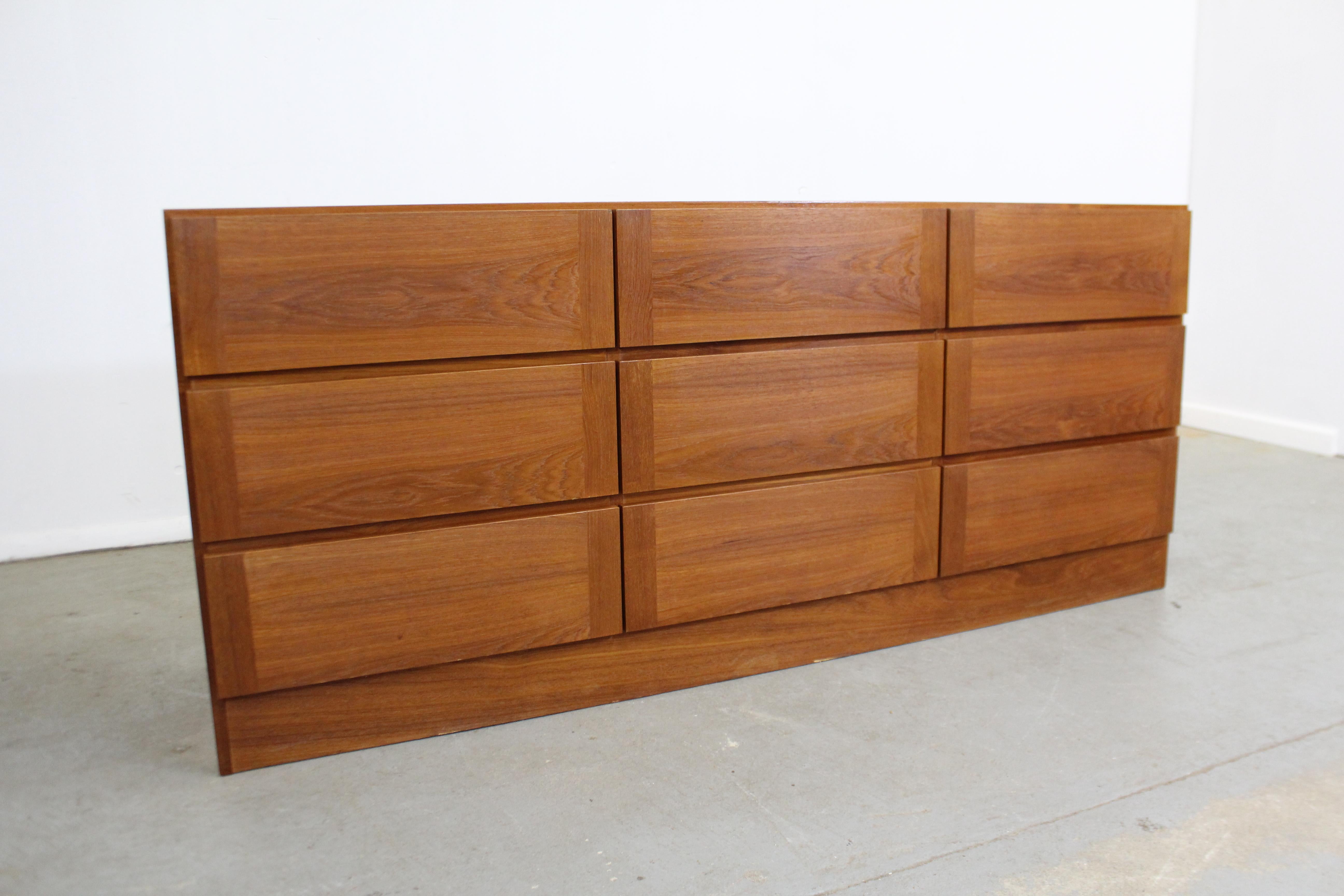 Offered is a Danish modern gentleman's chest by Vinde Mobelfabrik. It is made of teak, featuring nine drawers that all open smoothly (not dovetailed). In good vintage condition with some surface scratches, water stain on top and general age wear. It