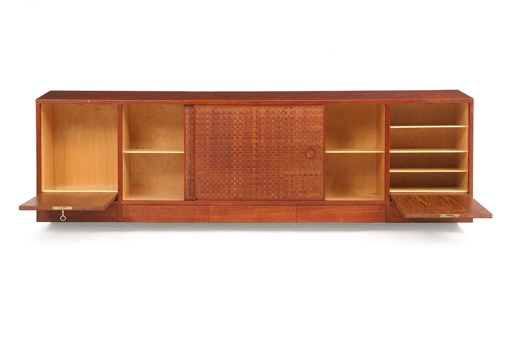 Origin: Denmark
Designer: Unknown
Manufacturer: Unknown - Retailed at Illums Bolighus in the 1950s
Era: 1950s
Materials: Teak
Dimensions: 73” wide x 12” deep x 21.5” tall 

Condition: In good original condition with some cosmetic wear (will