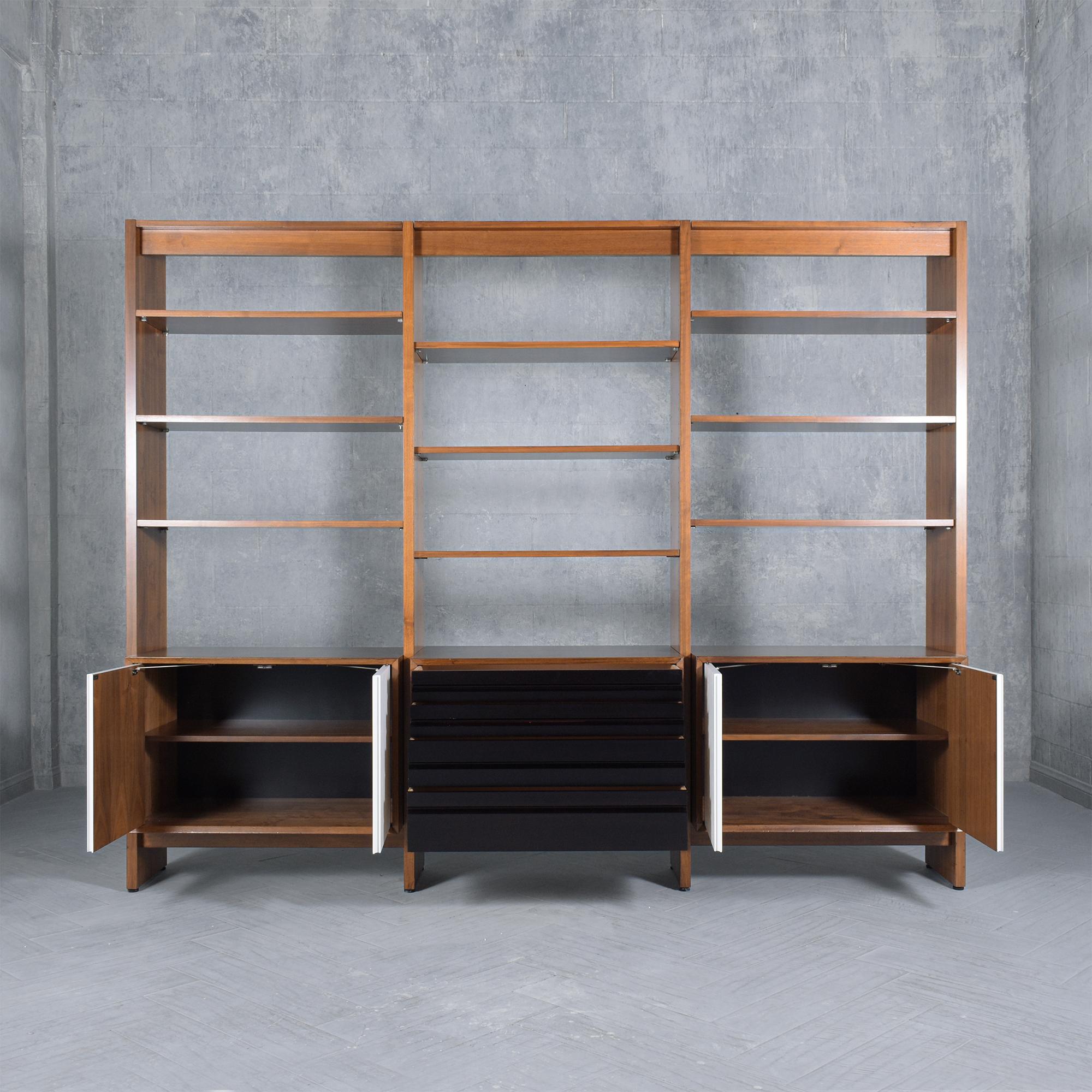 Discover the essence of 1980s Danish craftsmanship with our Mid-Century Modern Wall Unit Bookcase, beautifully handcrafted from select walnut wood. Expertly restored and refinished by our in-house artisans, this vintage gem radiates a timeless