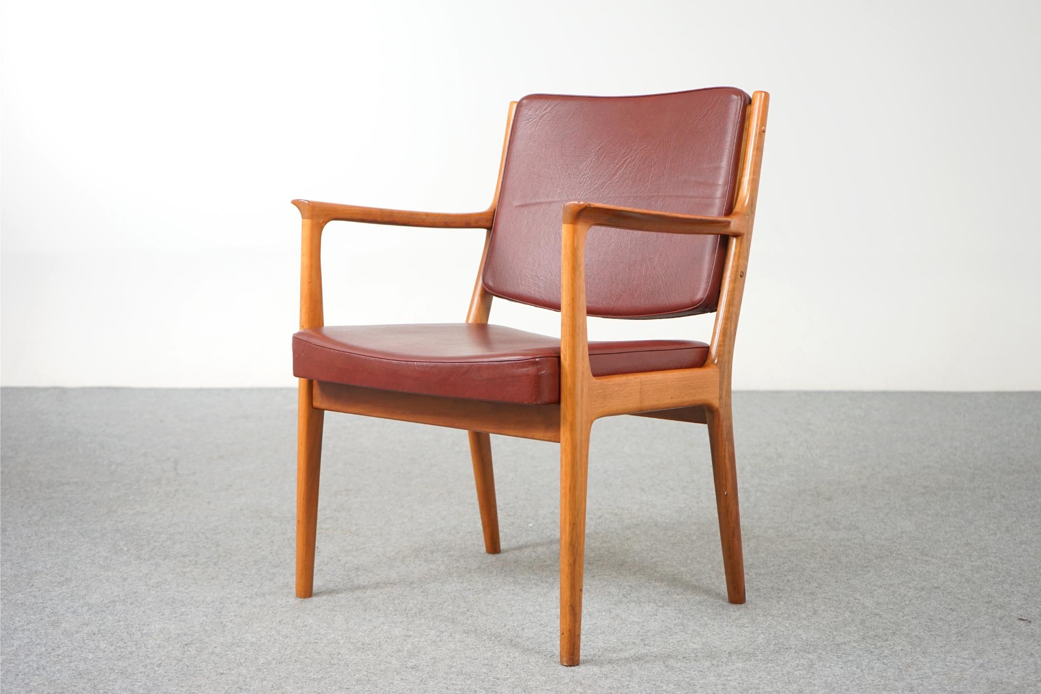 Walnut Danish armchair, circa 1970's. Sturdy solid wood frame is wonderfully scaled for your many seating needs, home or office! The elegant frame with swooping arms makes this clean modern design easy to combine with other furniture. 

Relax in