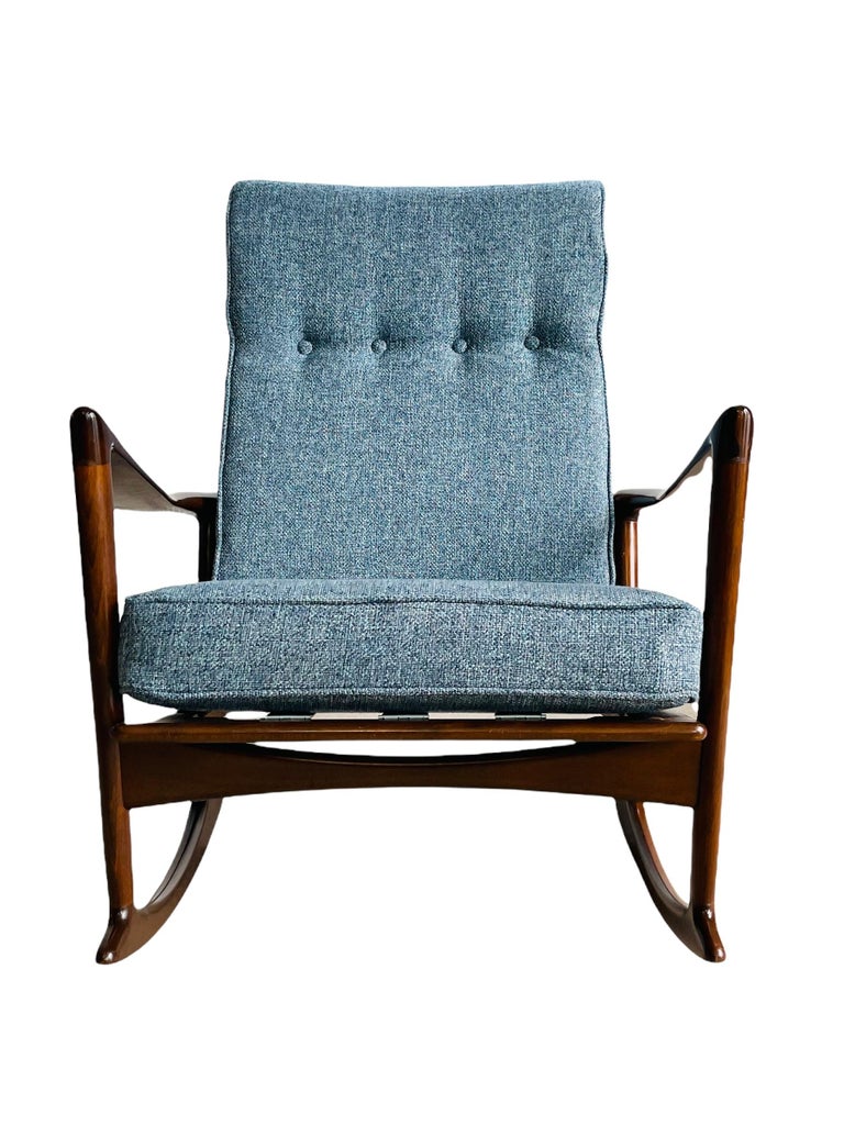 Iconic sculpted Mid-Century Danish Modern rocking chair by IB Kofod Larsen for Selig. A remarkable example of one of Larsen’s best designs. Sculpted walnut stained solid beechwood frame is immaculate - finish in a gorgeous semigloss lacquer. Newly