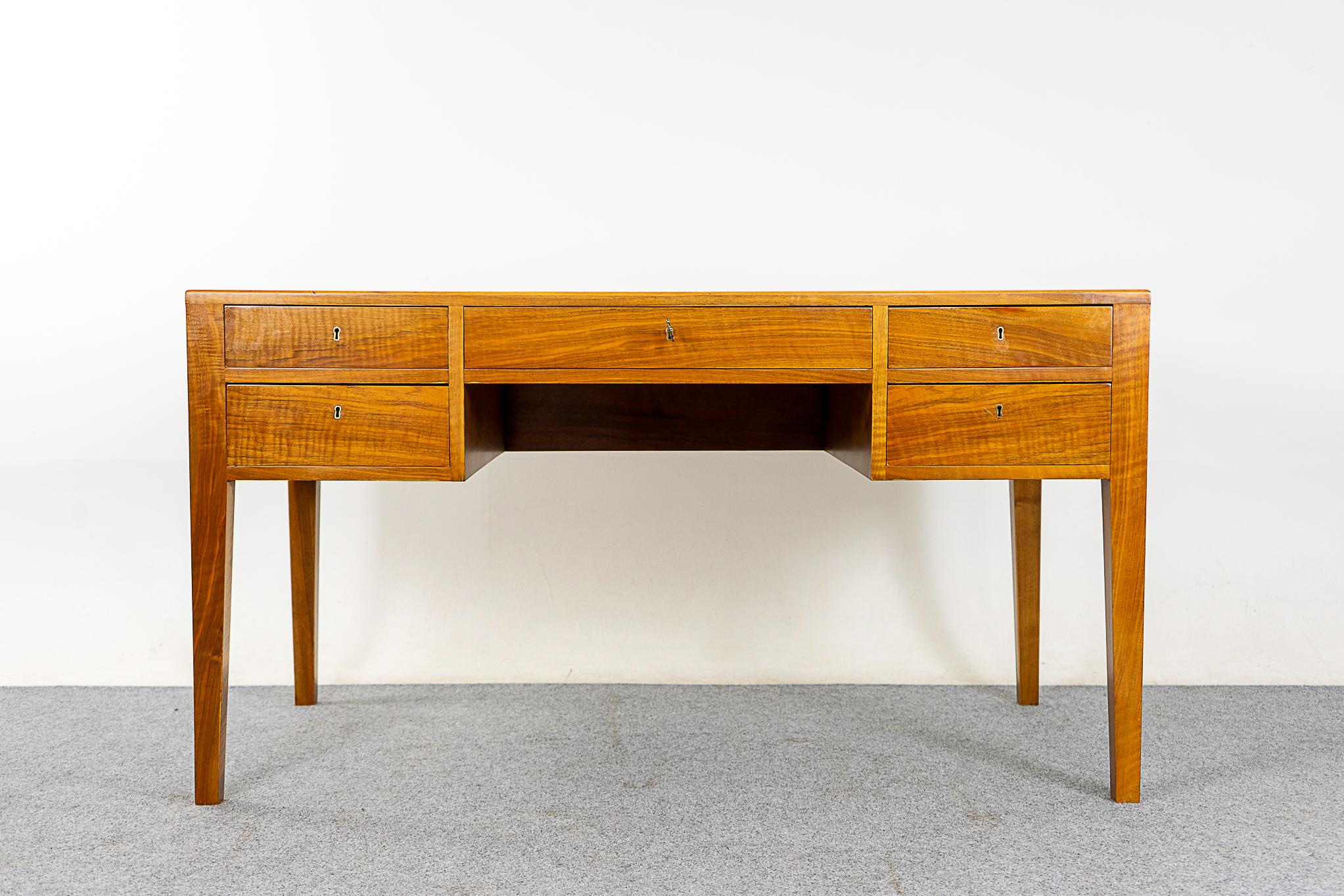 Walnut mid-century desk, circa 1960's. Clean modern lines with stunning grain patterns on the top! Finished on both sides, can be placed in the center of a room and look fantastic from every angle.

Please inquire for remote and international