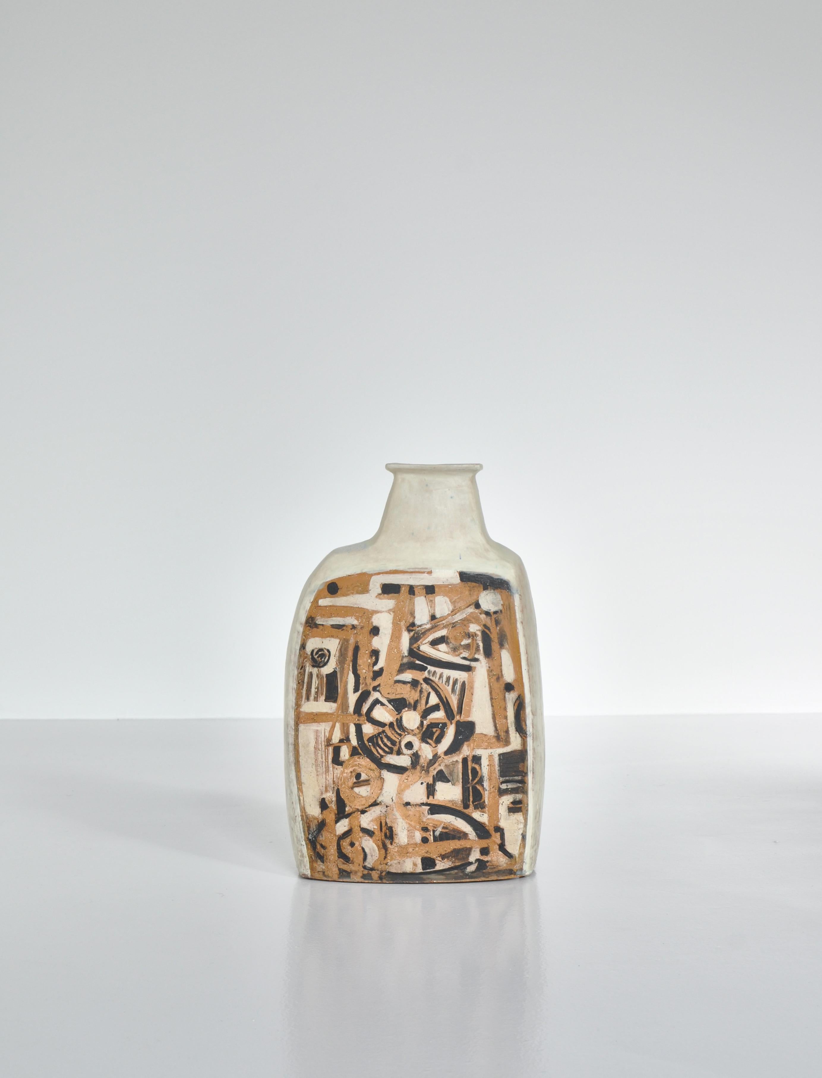 Wonderful handmade ceramics floor vase by renown Danish artist Jeppe Hagedorn-Olsen. Parts of the vase is covered with white glazing while the fronts are unglazed and decorated with various symbols and abstract forms. The vase is unique and was made