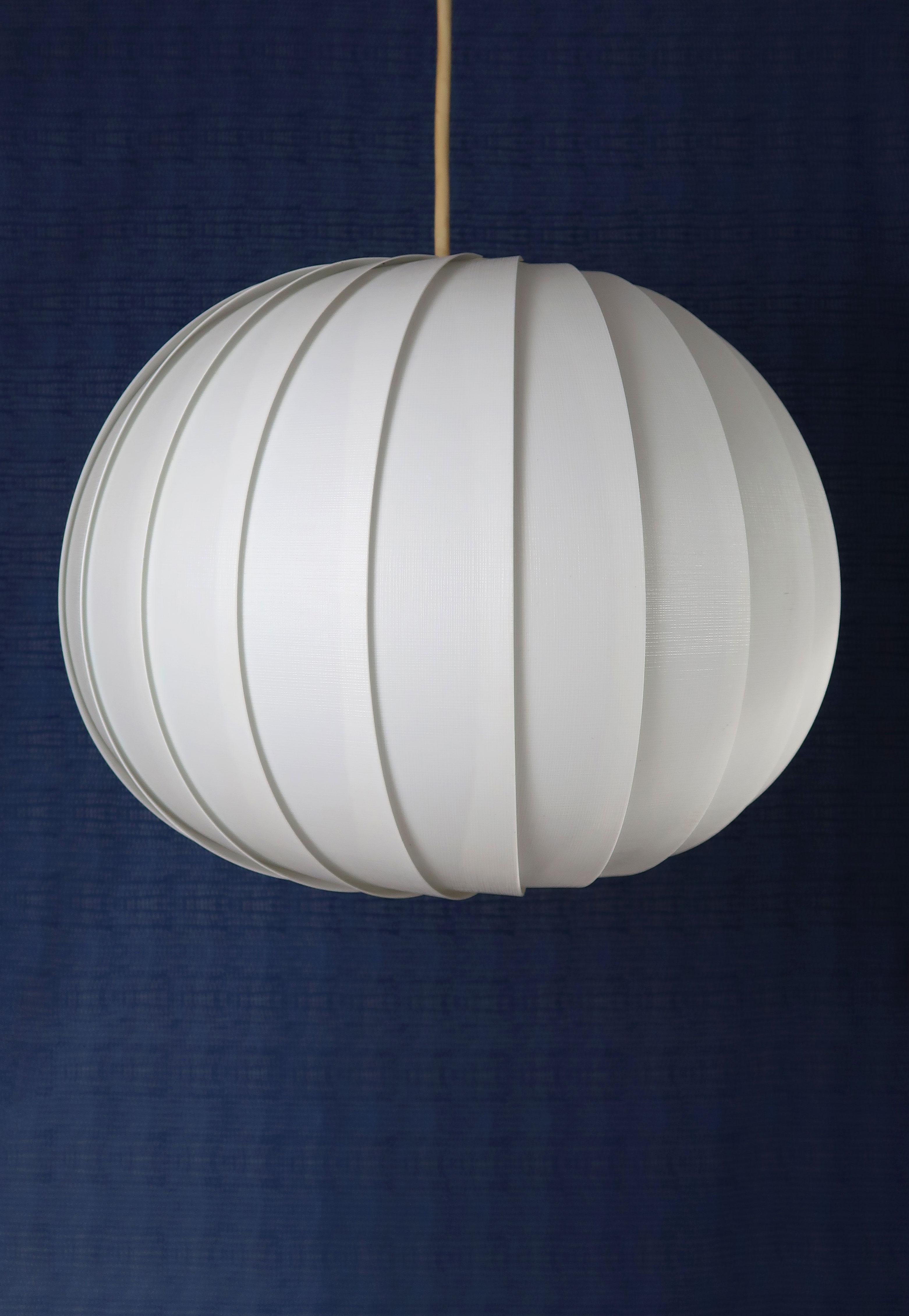Scandinavian Mid-Century Modern spherical white acrylic pendant consisting of layered white, textured strips gathered on top and bottom creating an organic globe shape. Designed in 1972 by Lars Eiler Schiøler (1913-1982) for Høyrup Lights. Model