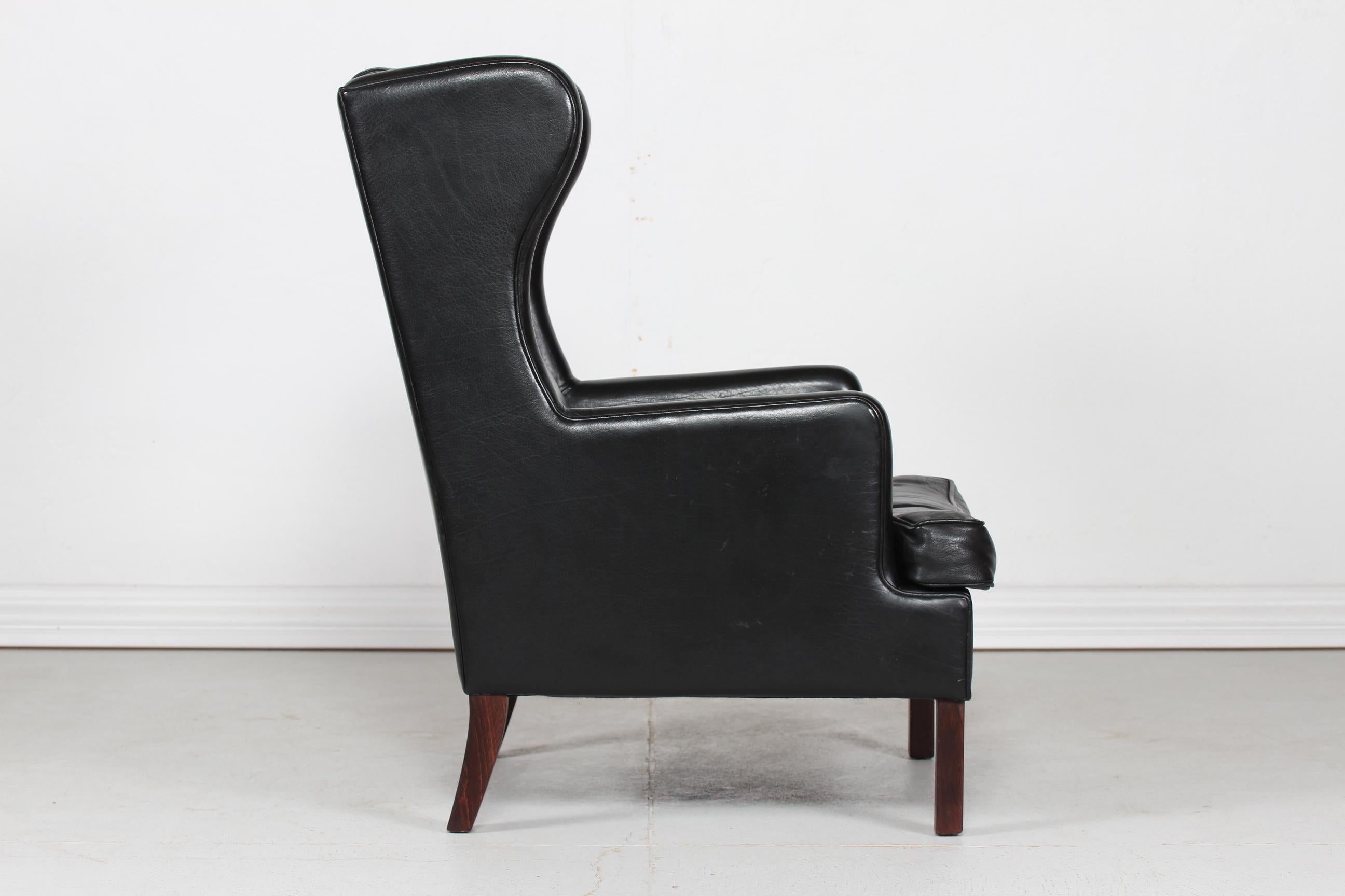 Mid-Century Modern Danish Modern Wingback Chair and Stool with Black Leather in Kaare Klint Style For Sale