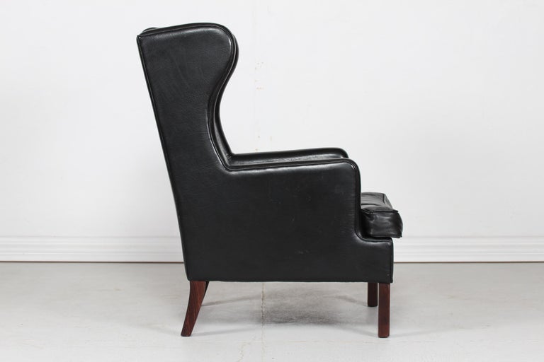 Danish Modern Wing Chair and Stool with Black Leather in Kaare Klint