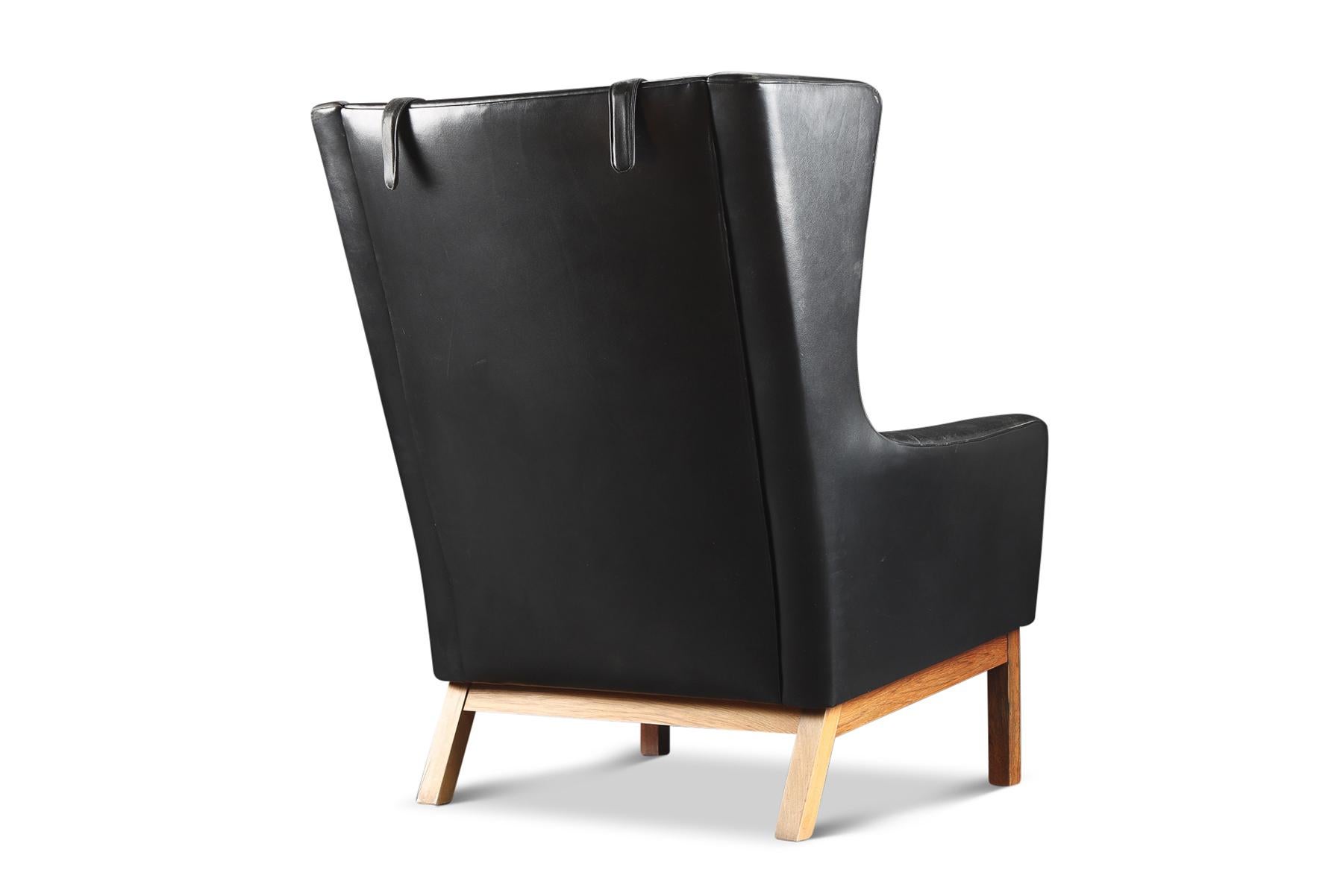 Danish Modern Wingback Lounge Chair in Black Leather + Rosewood In Good Condition In Berkeley, CA