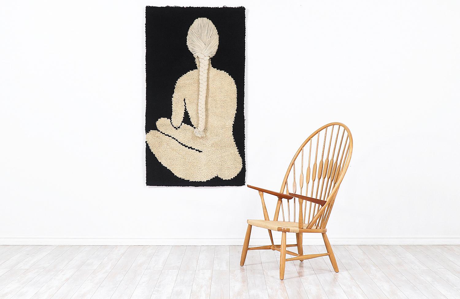 Large Danish modern hanging pop art rug designed and manufactured by Rya in Denmark, circa 1960s. This gorgeous rug has a unique design with a light creamed wool and a braided woman silhouette framed on a black wool rectangle exhibiting rich